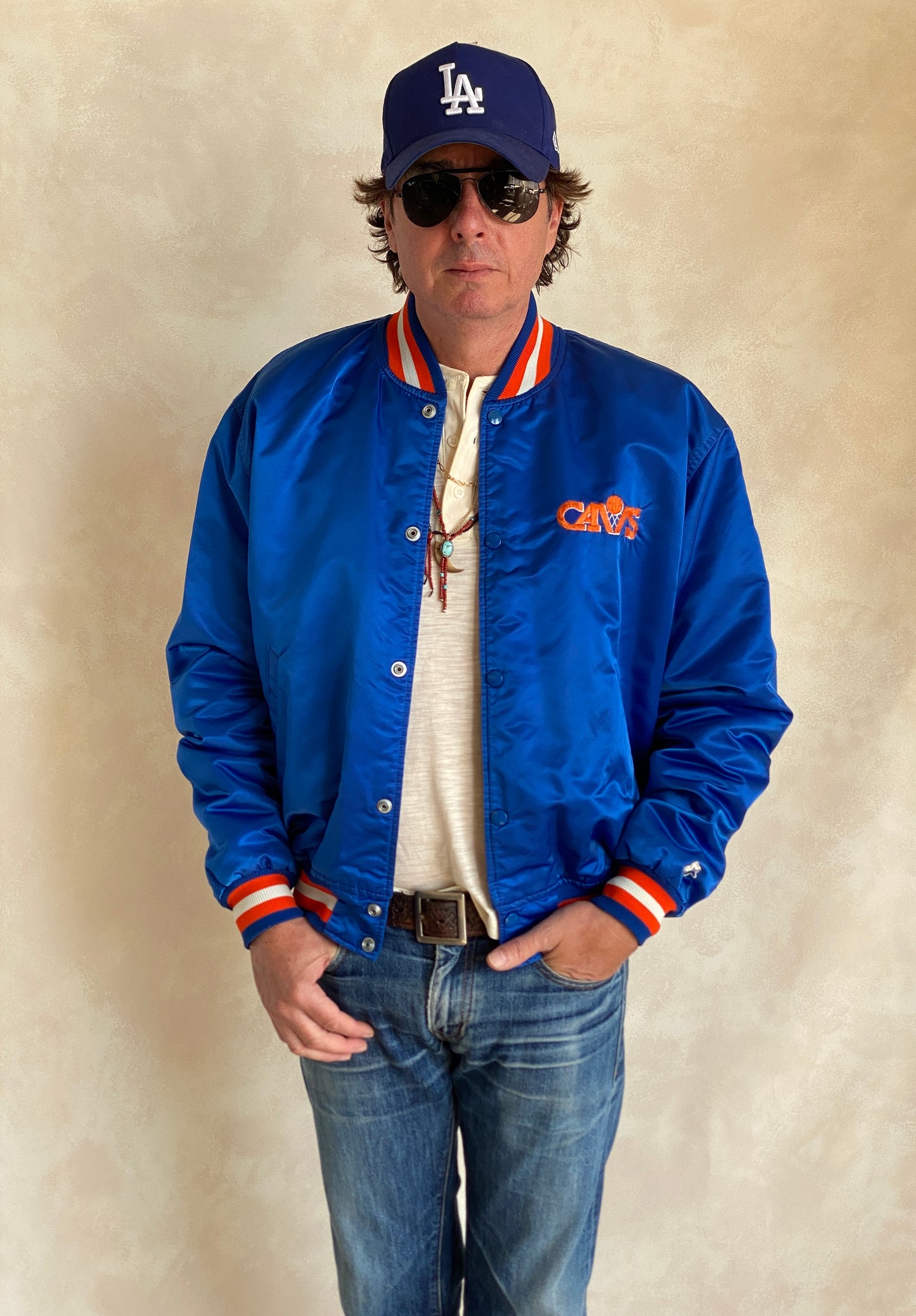 Vintage 1980s Cleveland Cavaliers Starter satin jacket with retro logo and bold team colors, size XL