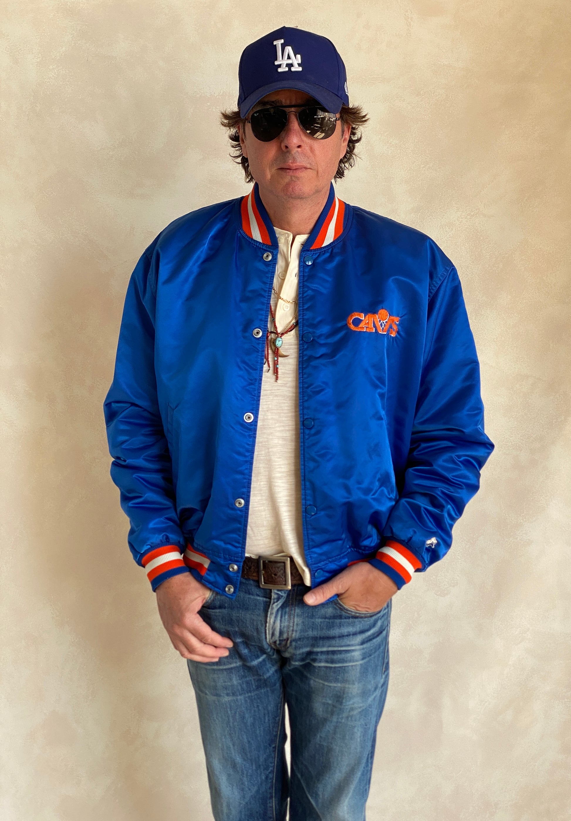 Vintage 1980s Cleveland Cavaliers Starter satin jacket with retro logo and bold team colors, size XL
