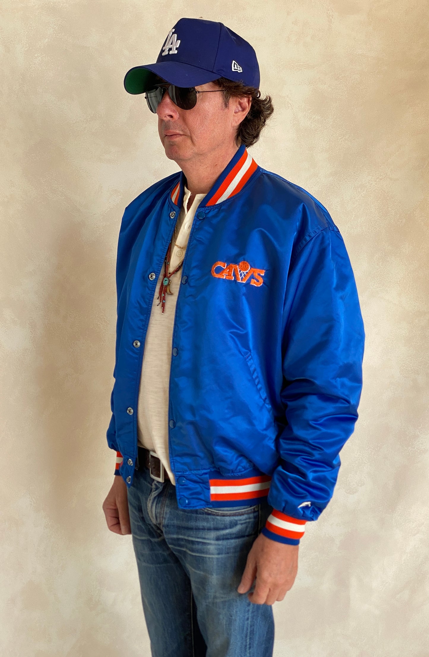 Vintage 1980s Cleveland Cavaliers Starter satin jacket with retro logo and bold team colors, size XL