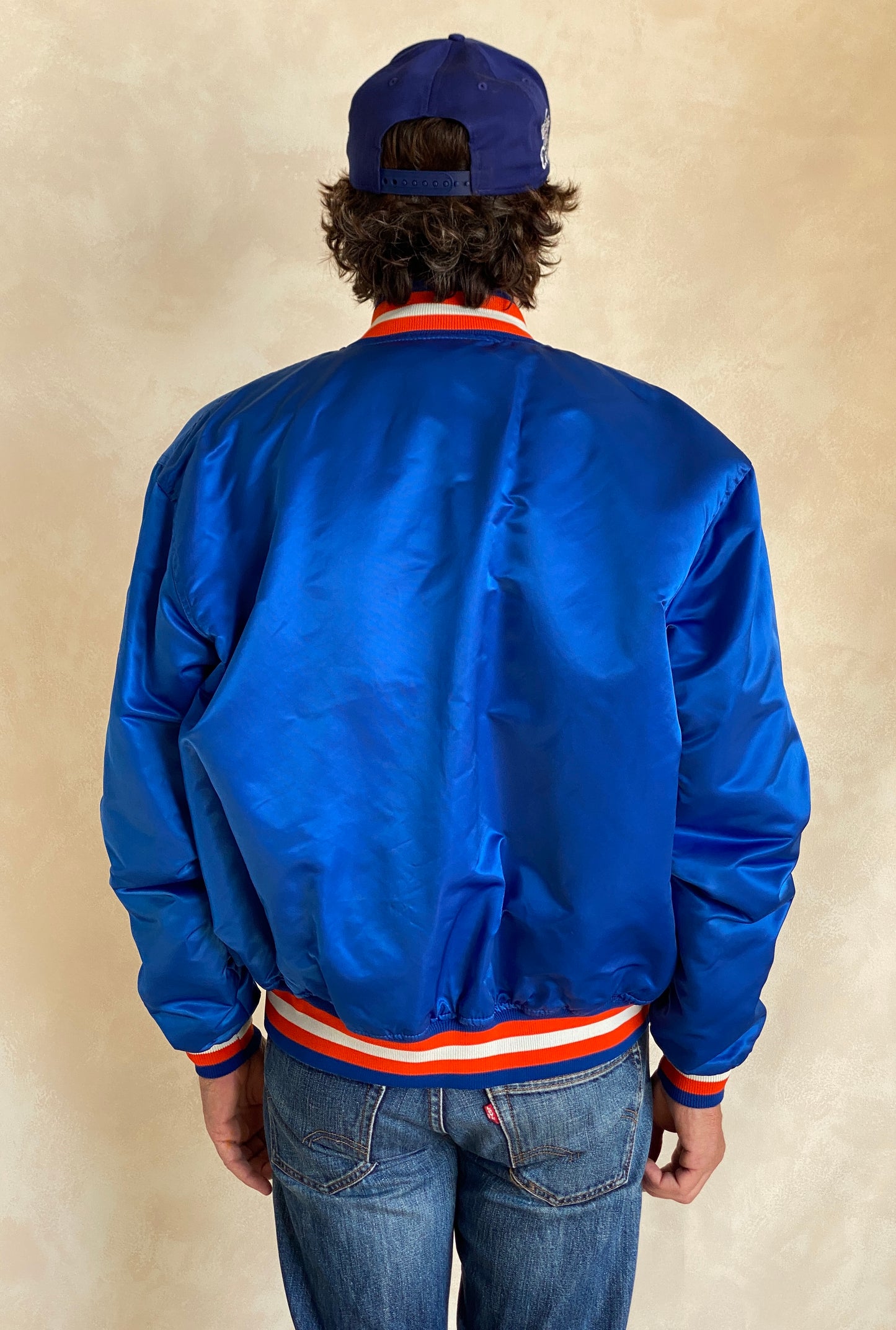 Vintage 1980s Cleveland Cavaliers Starter satin jacket with retro logo and bold team colors, size XL