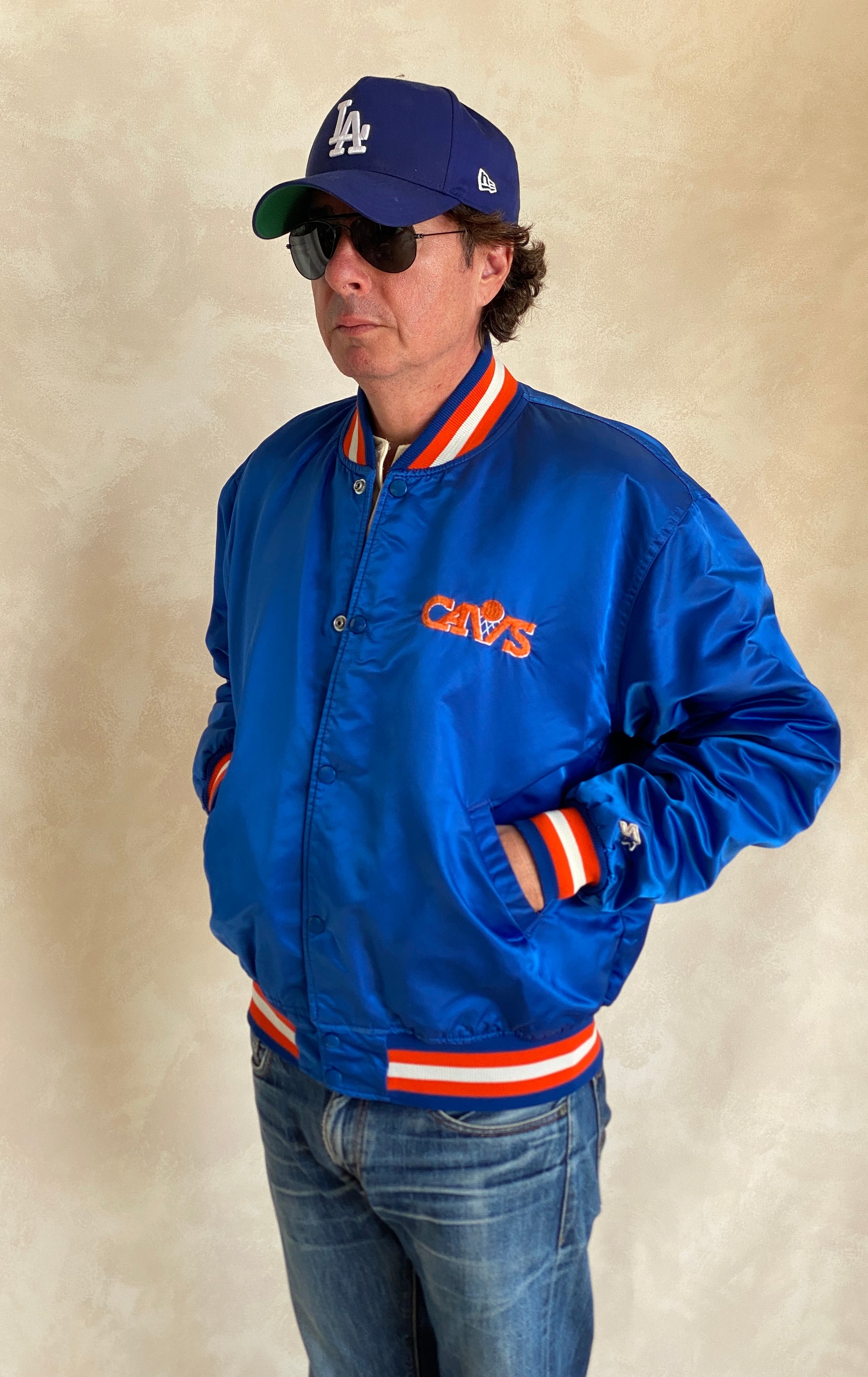 Vintage 1980s Cleveland Cavaliers Starter satin jacket with retro logo and bold team colors, size XL