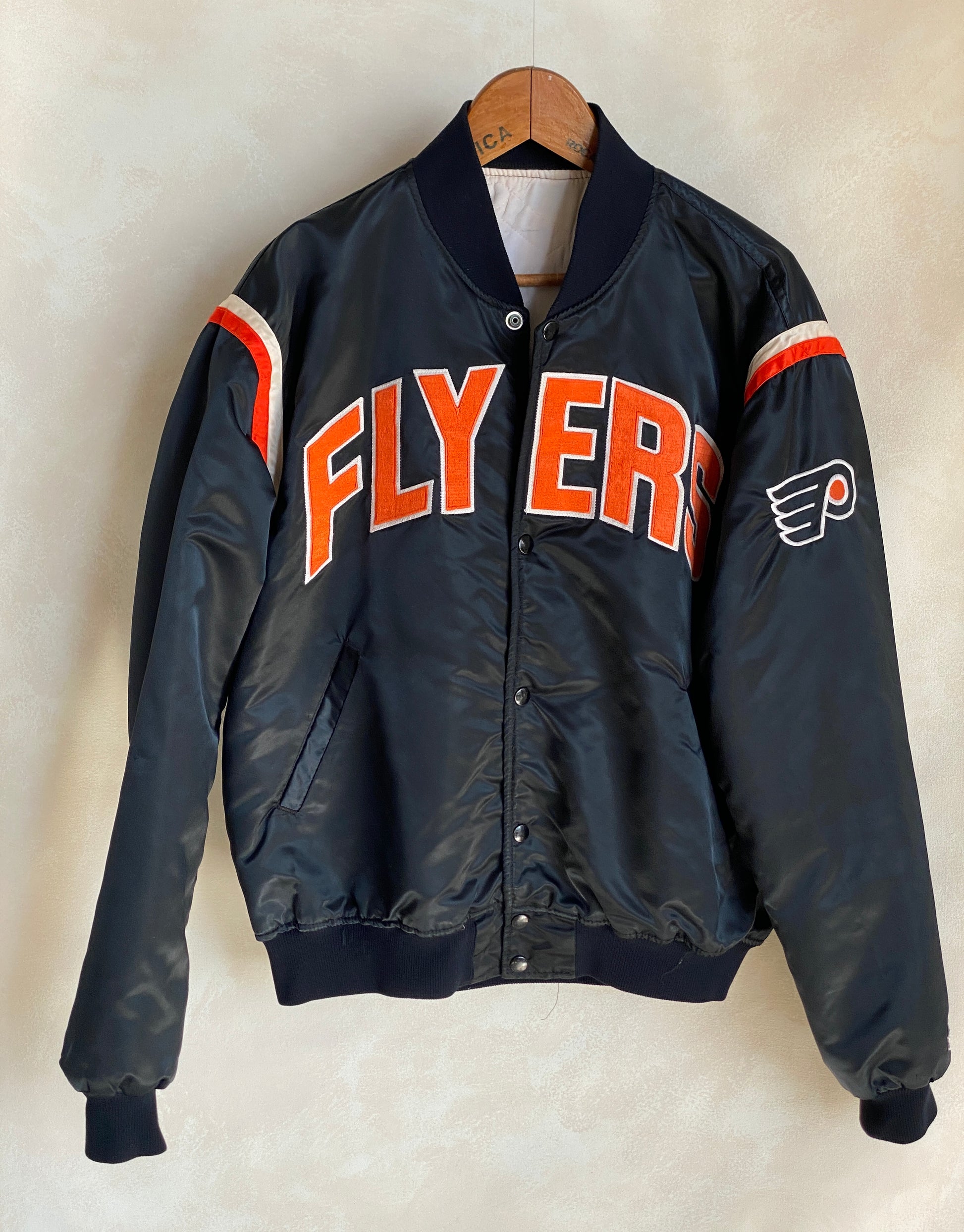 Vintage Philadelphia Flyers Starter satin jacket made in USA, size XLarge.