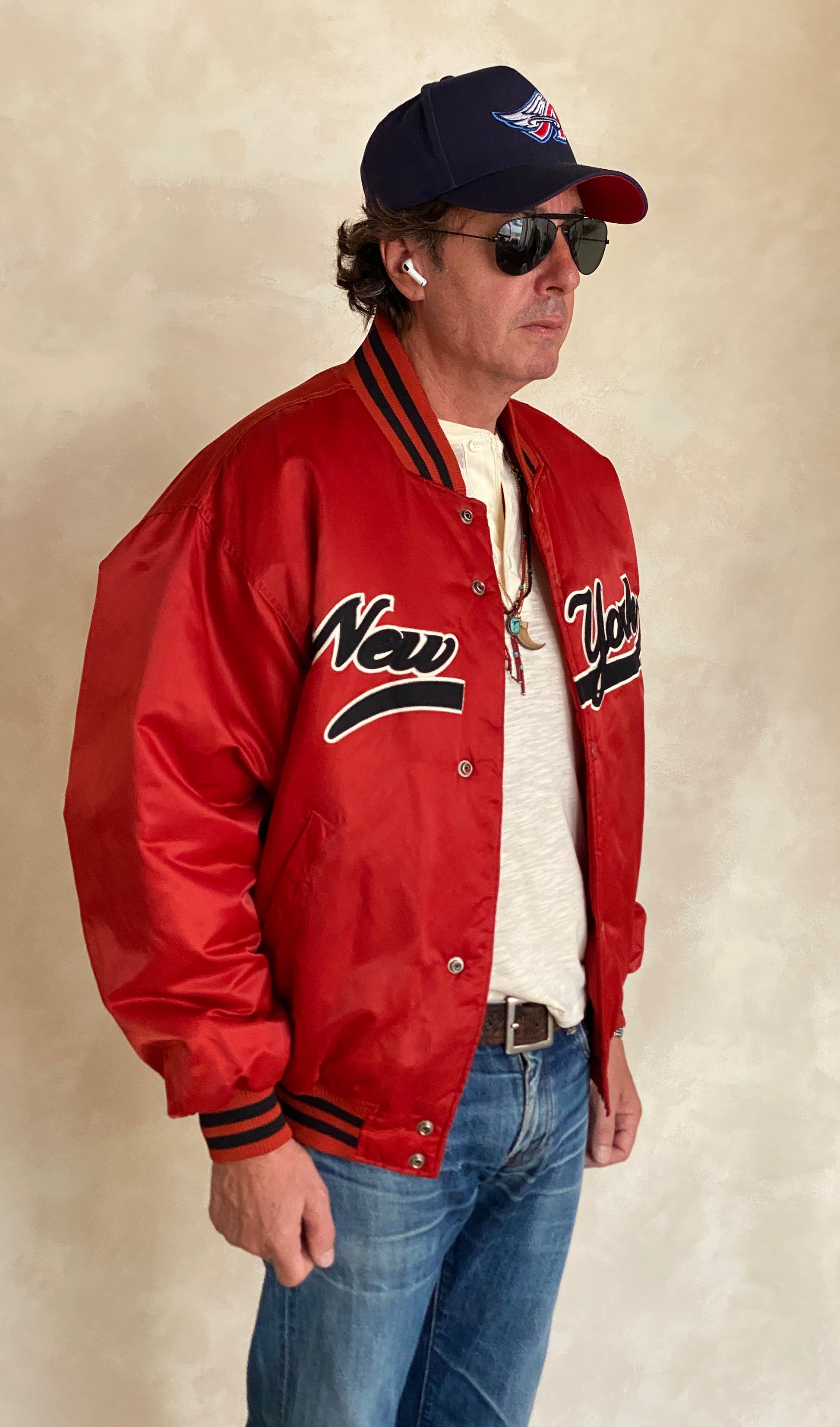 Vintage 1990s New York Starter satin jacket, classic sports style, size large.