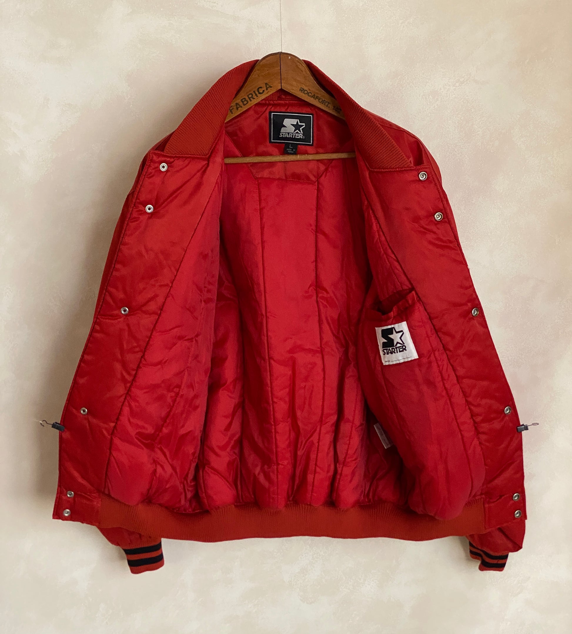 Vintage 1990s New York Starter satin jacket, classic sports style, size large.