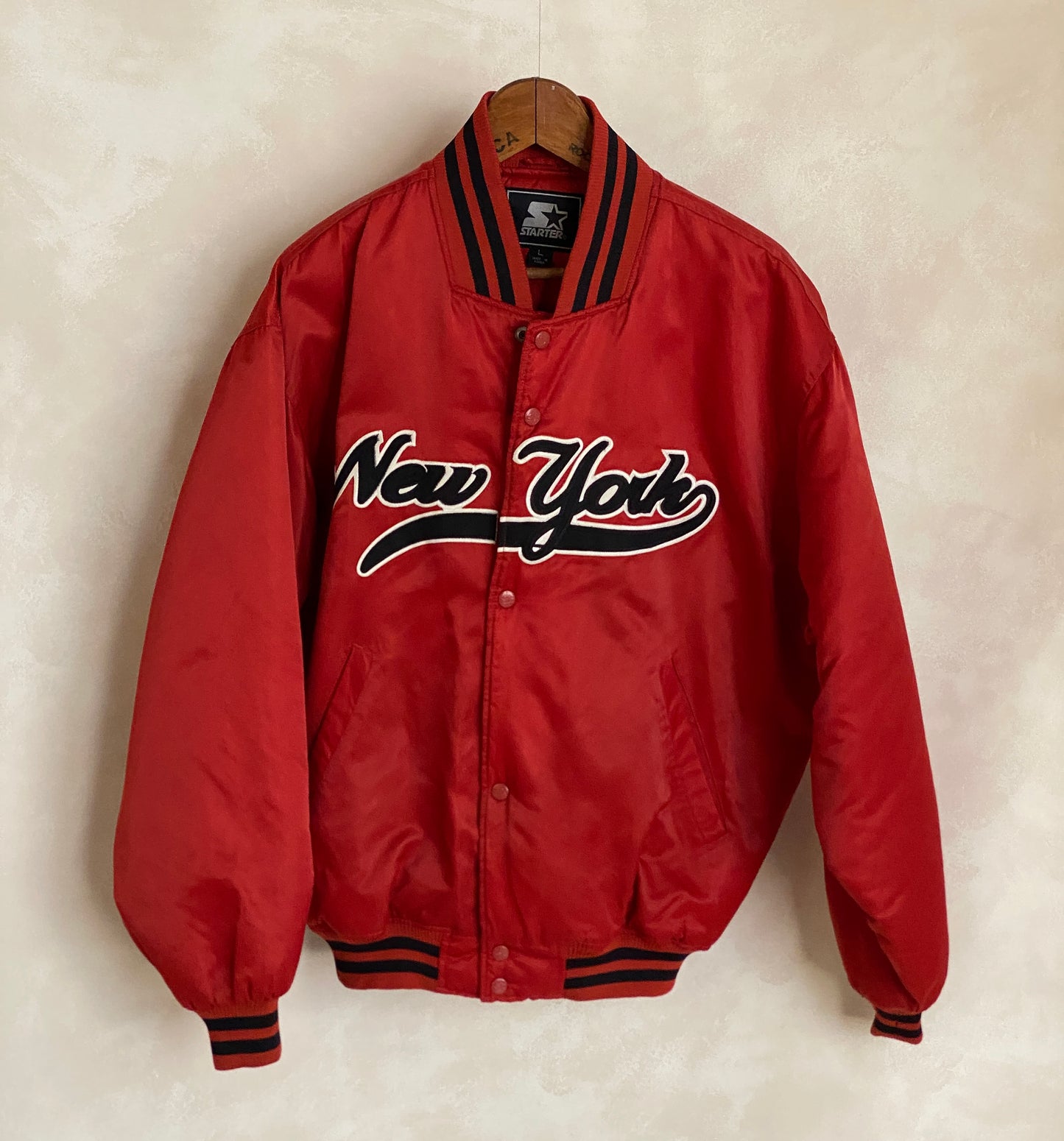 Vintage 1990s New York Starter satin jacket, classic sports style, size large.