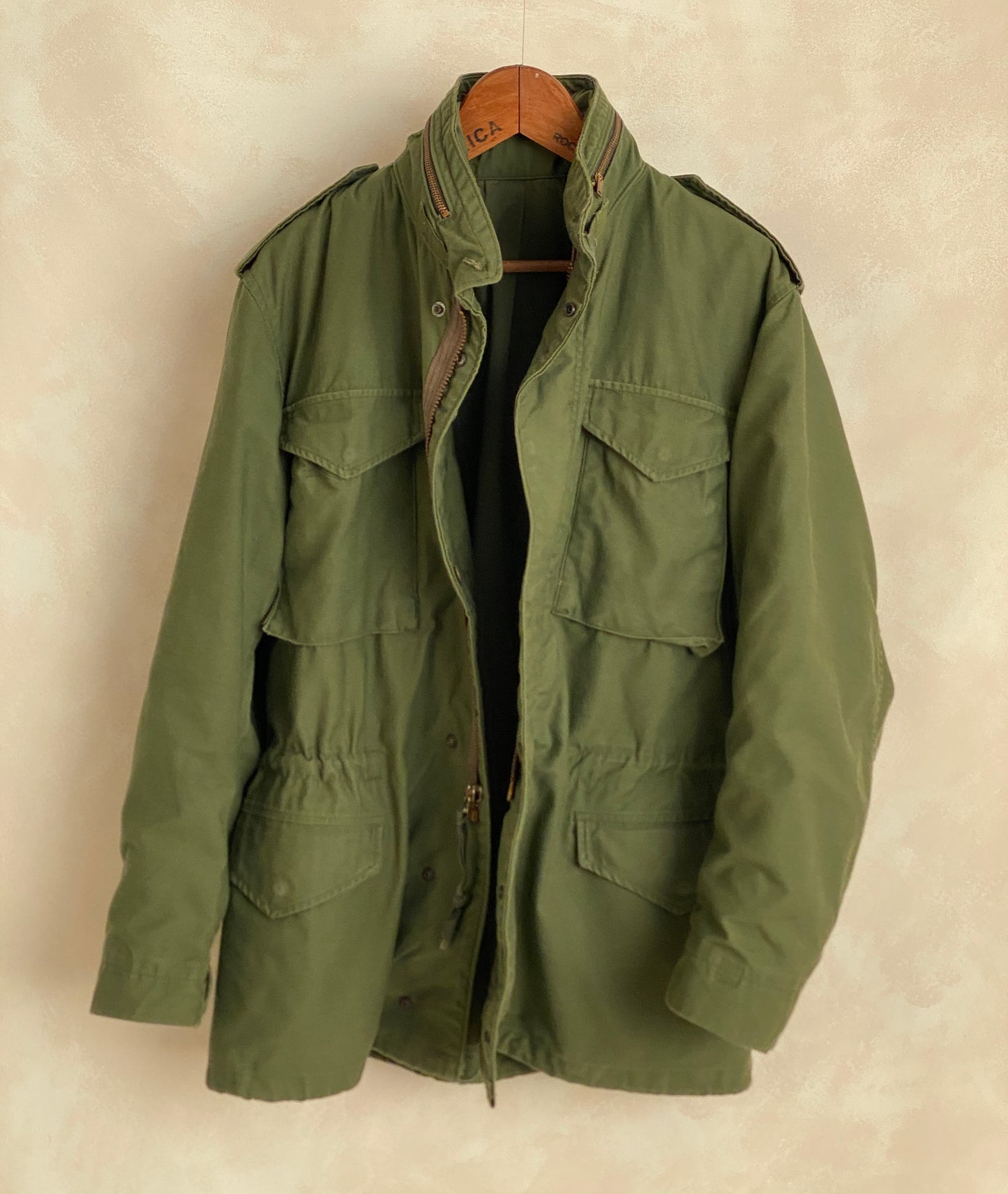 Authentic vintage US Army M-65 OG-107 field jacket, olive drab, size Medium Long.