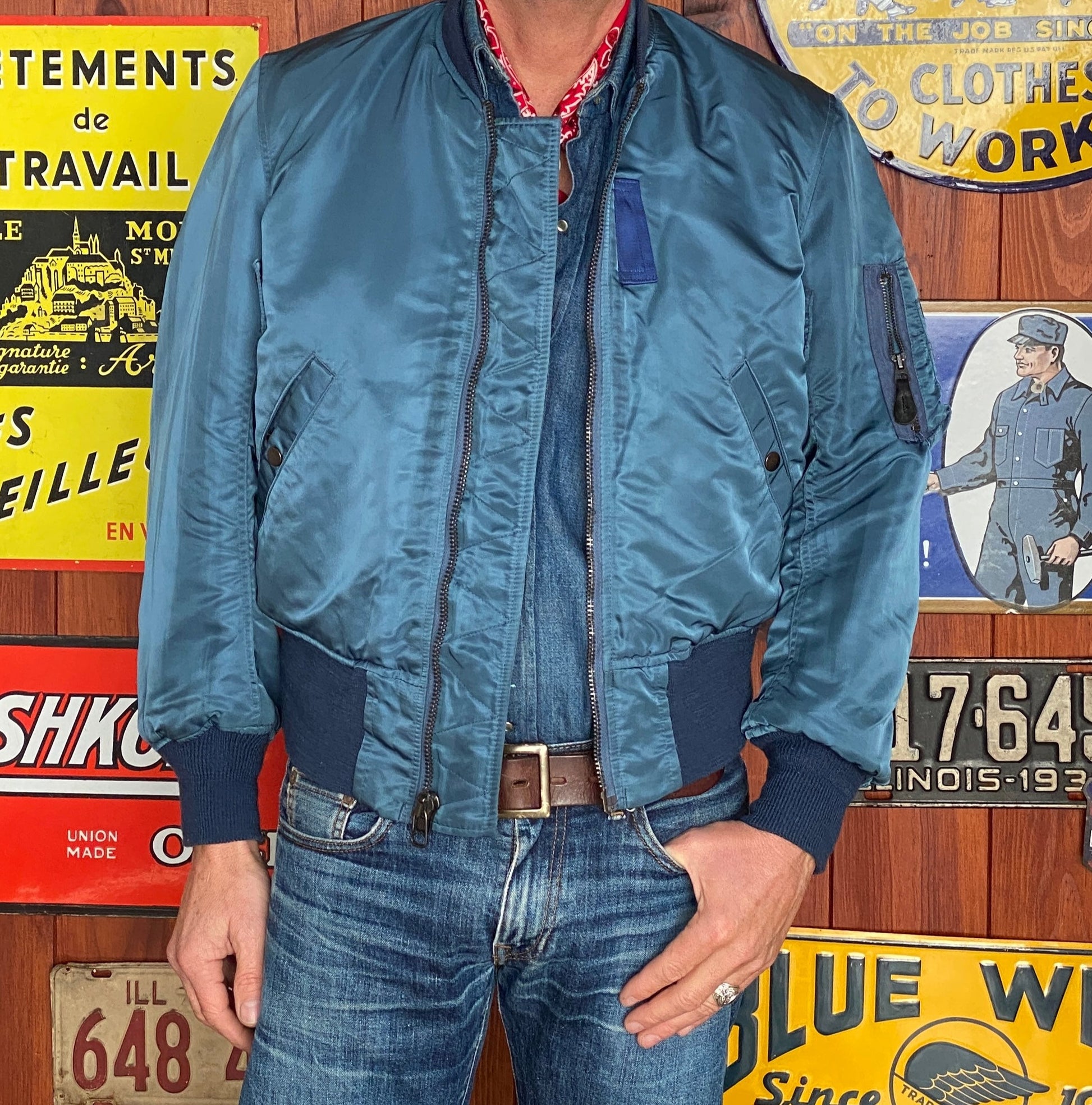 Vintage MA-1 flight bomber jacket by Weintraub Brothers, nylon shell with orange lining, size Small.
