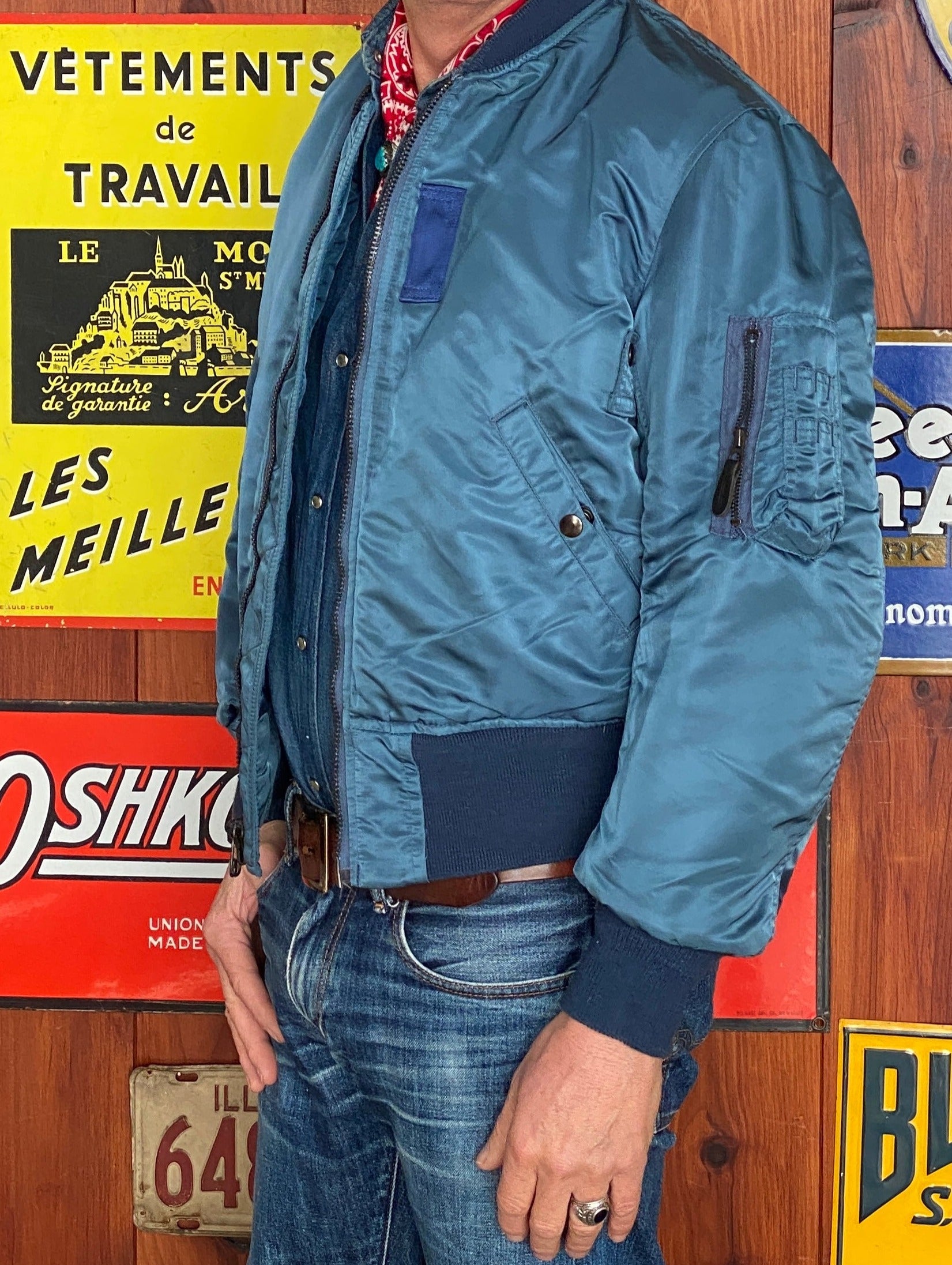 Vintage MA-1 flight bomber jacket by Weintraub Brothers, nylon shell with orange lining, size Small.