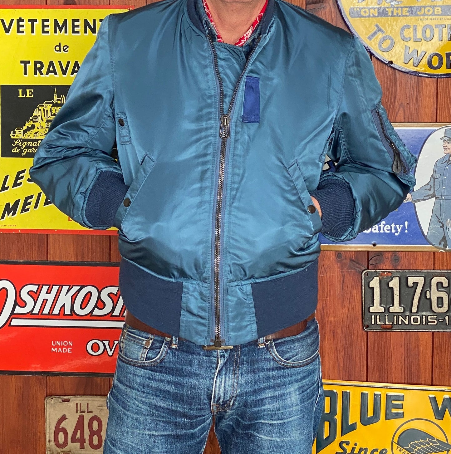 Vintage MA-1 flight bomber jacket by Weintraub Brothers, nylon shell with orange lining, size Small.
