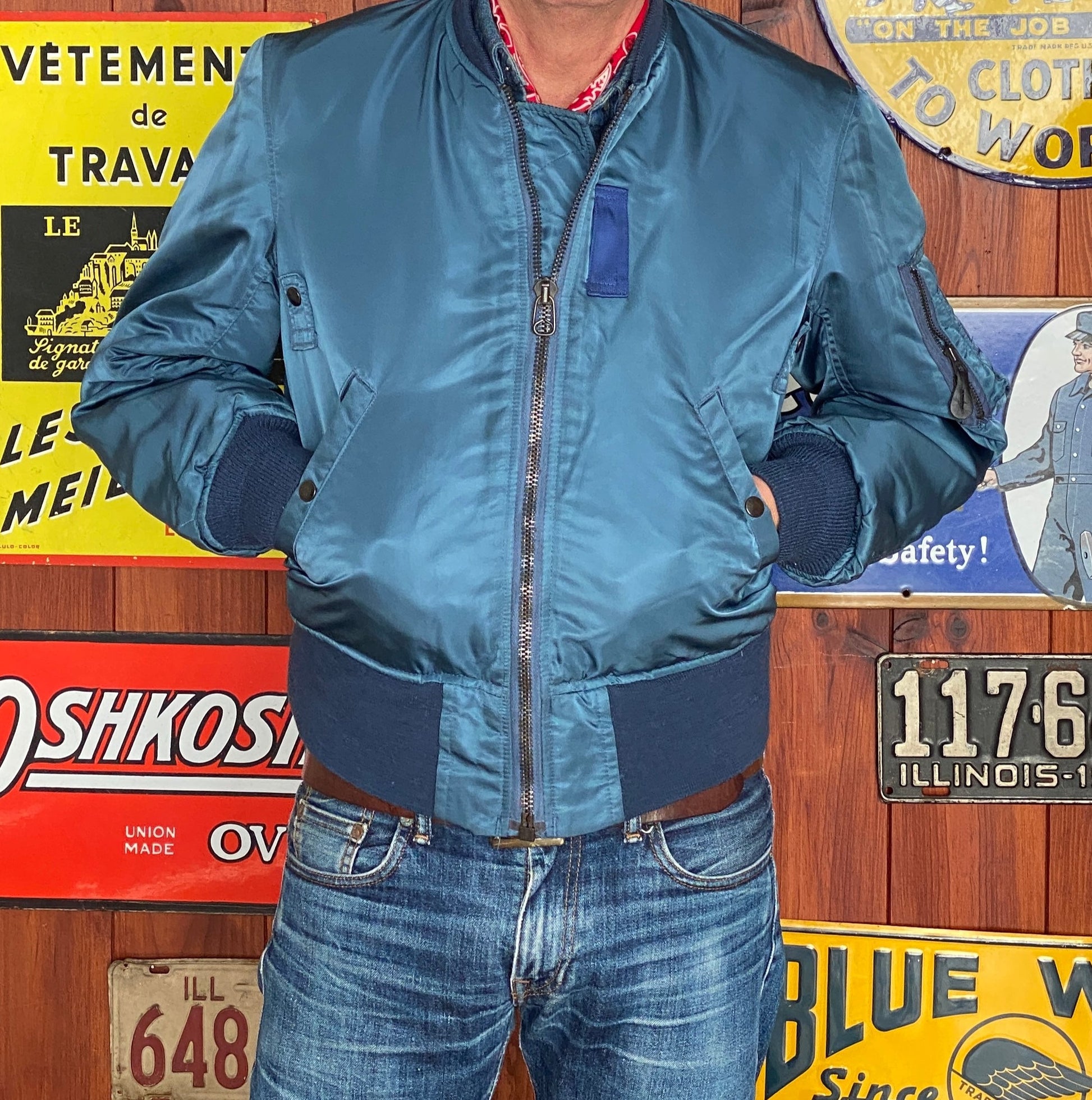 Vintage MA-1 flight bomber jacket by Weintraub Brothers, nylon shell with orange lining, size Small.