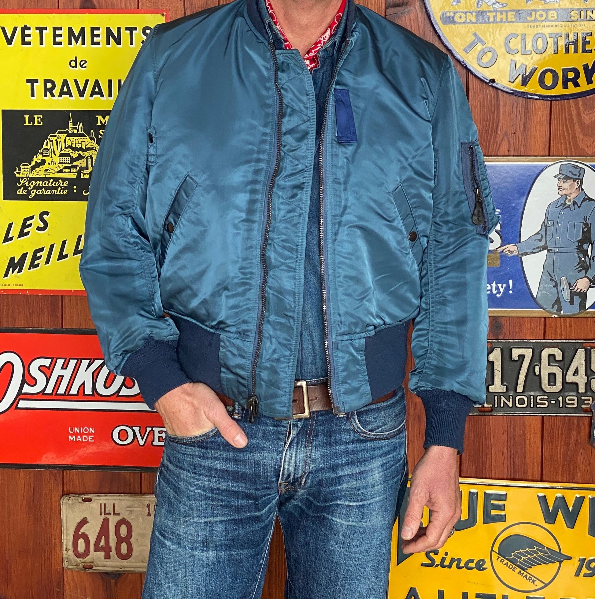 Vintage MA-1 flight bomber jacket by Weintraub Brothers, nylon shell with orange lining, size Small.