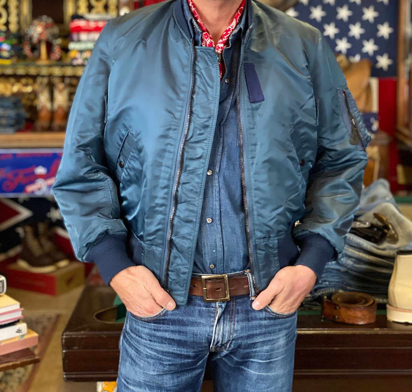 Vintage MA-1 flight bomber jacket by Weintraub Brothers, nylon shell with orange lining, size Small.
