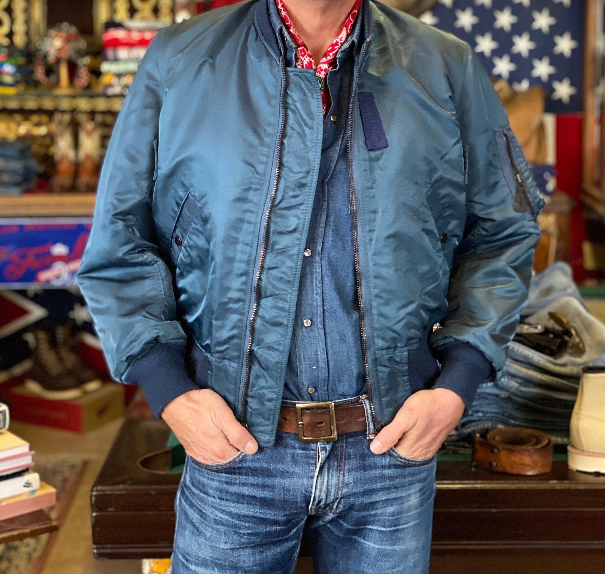 Vintage MA-1 flight bomber jacket by Weintraub Brothers, nylon shell with orange lining, size Small.
