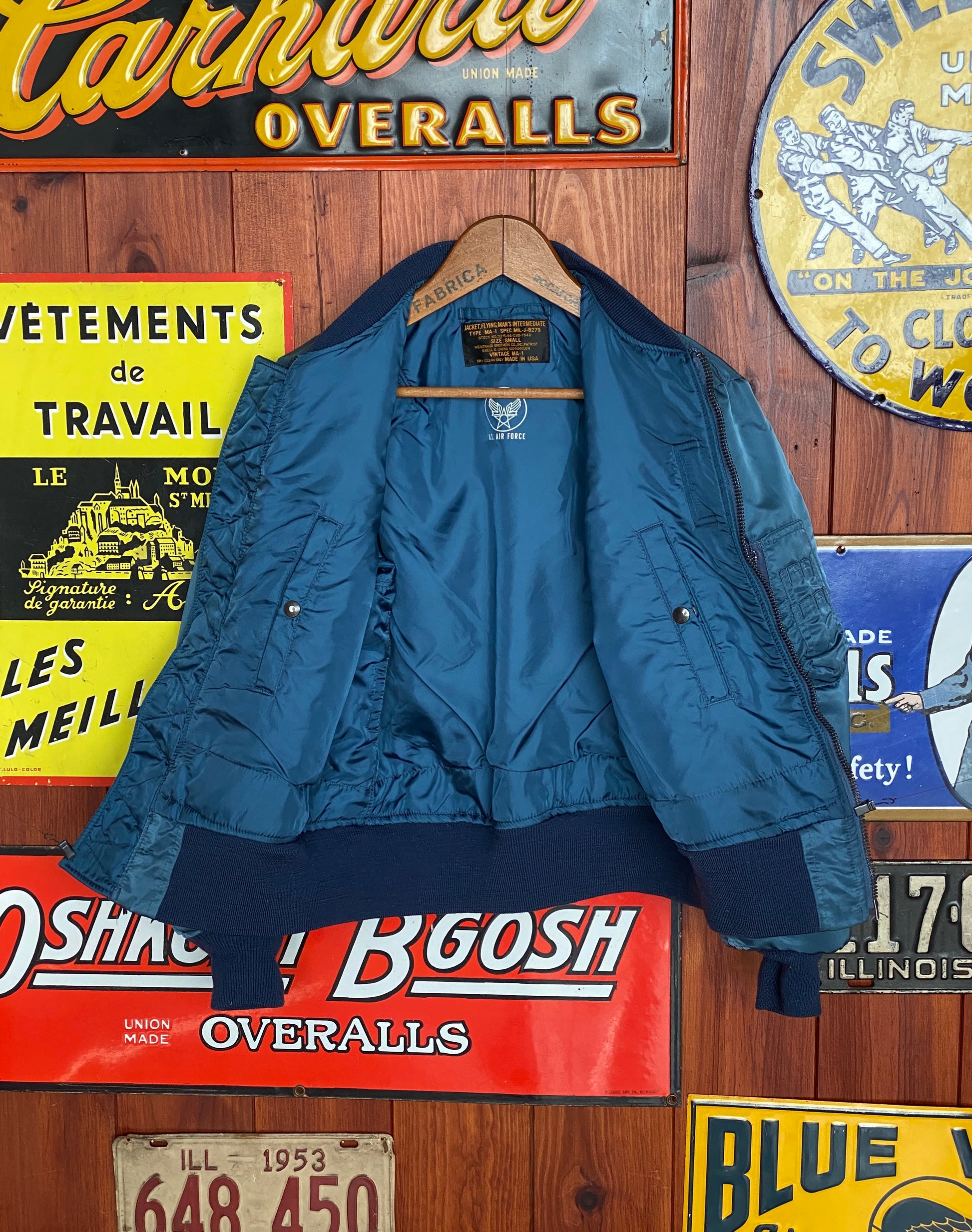 Vintage MA-1 flight bomber jacket by Weintraub Brothers, nylon shell with orange lining, size Small.