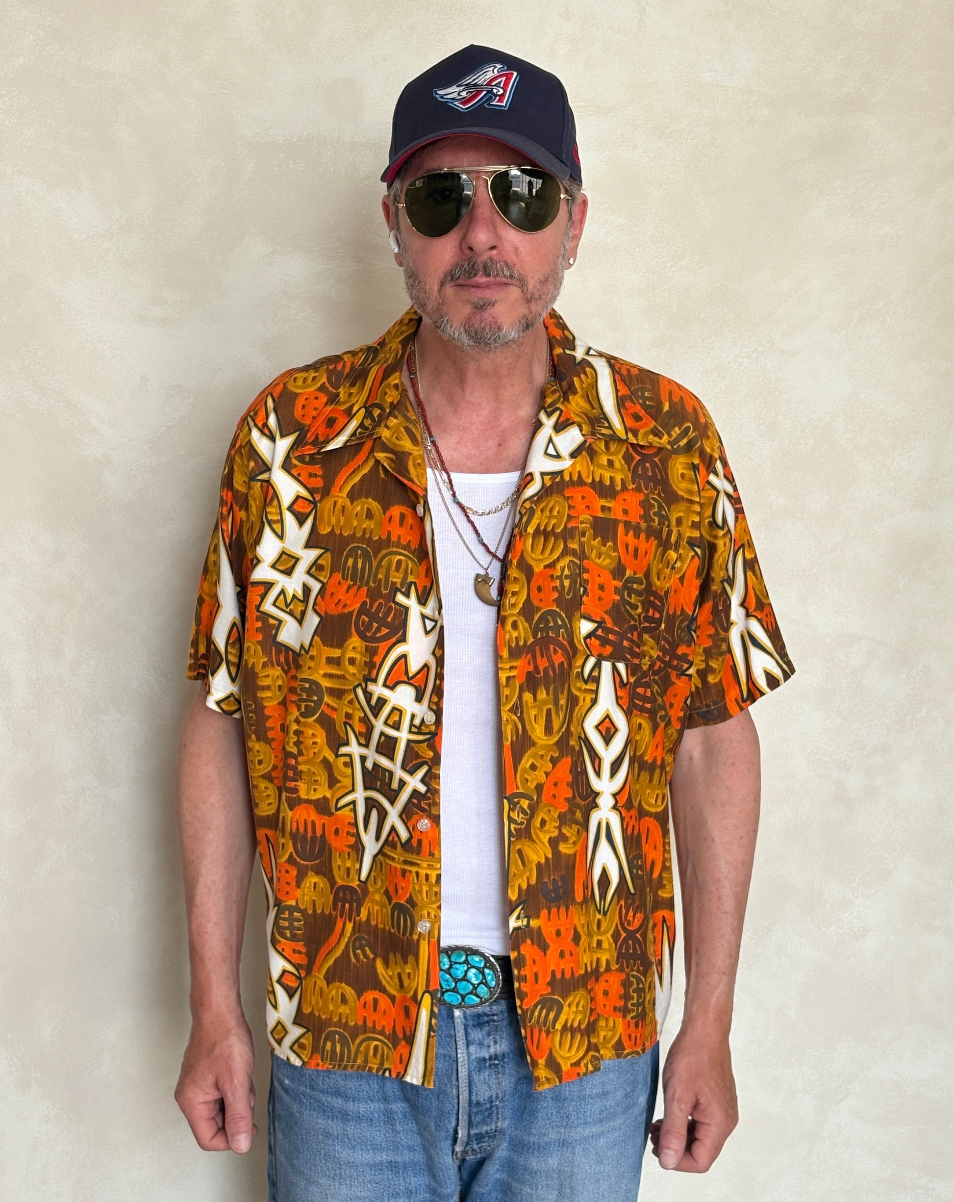 Vintage 1970s Hawaiian cotton shirt by Kauai with floral print, size XLarge.