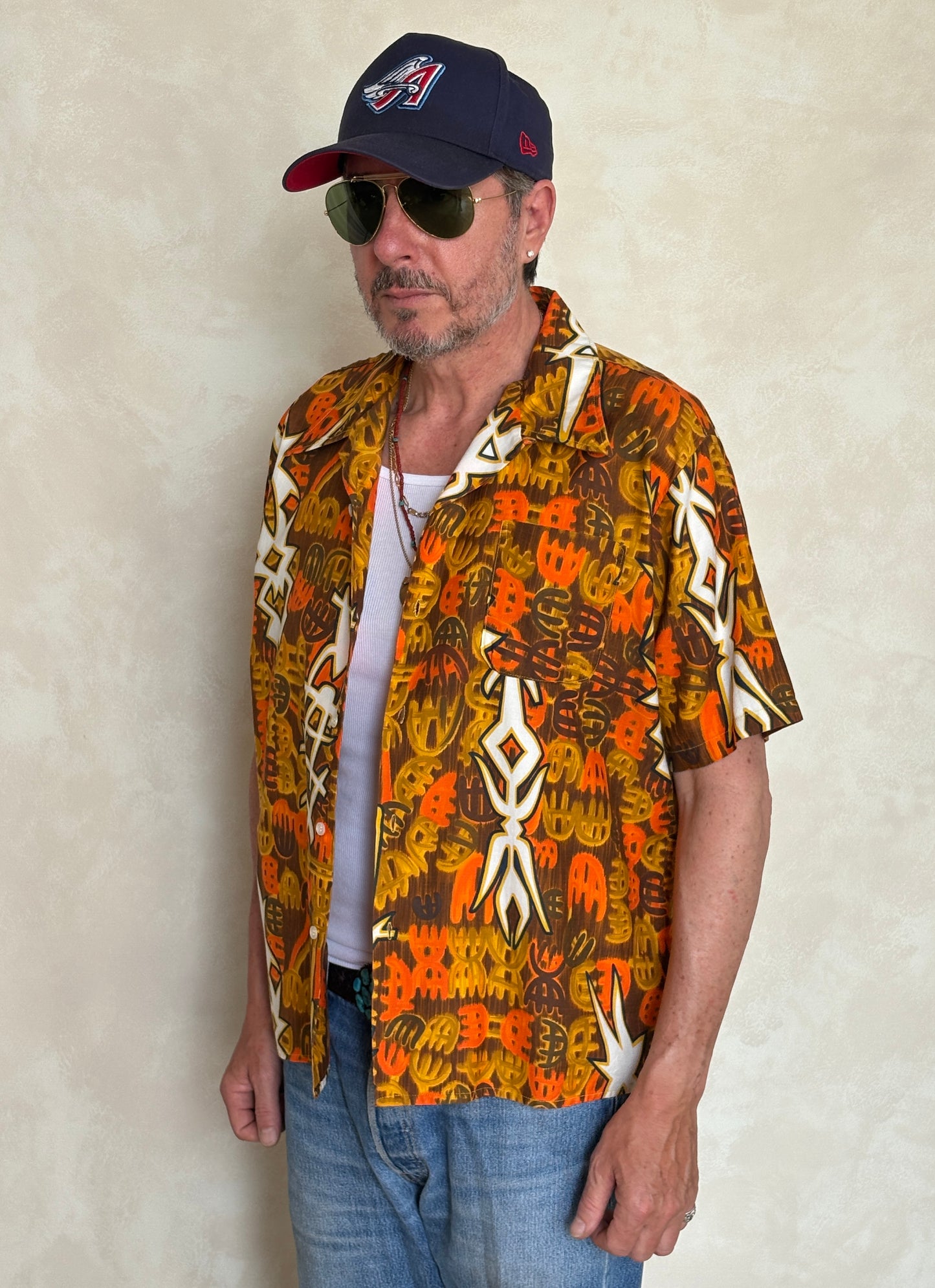 Vintage 1970s Hawaiian cotton shirt by Kauai with floral print, size XLarge.