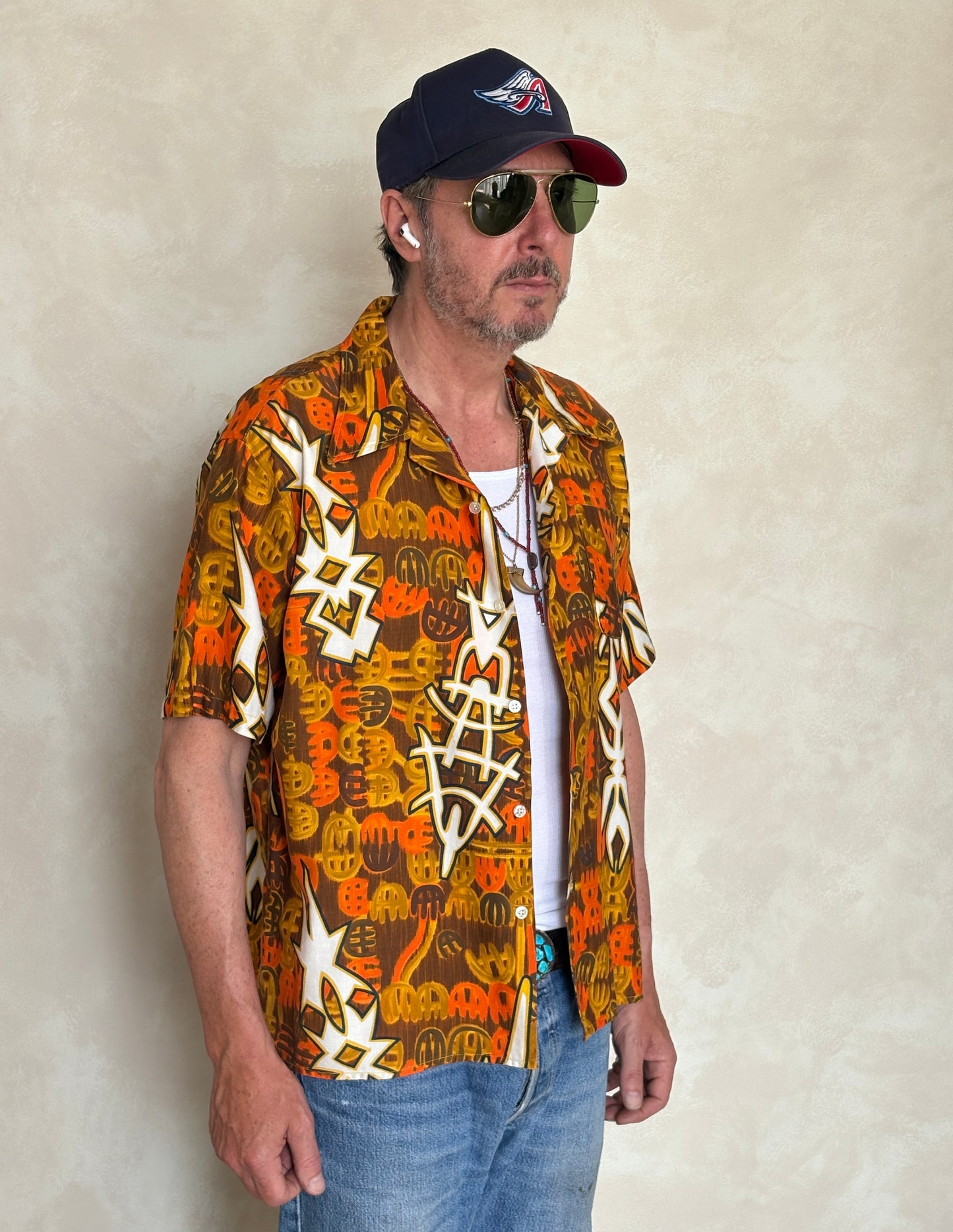 Vintage 1970s Hawaiian cotton shirt by Kauai with floral print, size XLarge.
