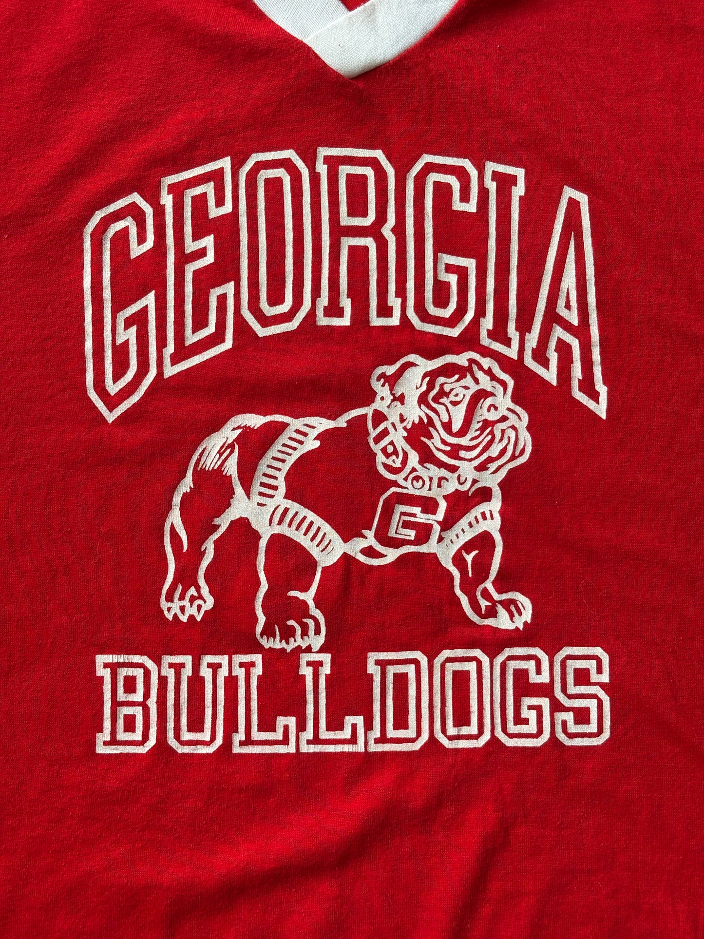 Vintage 1990s Georgia Bulldogs jersey t-shirt with bold collegiate style and classic mascot graphic, size XL