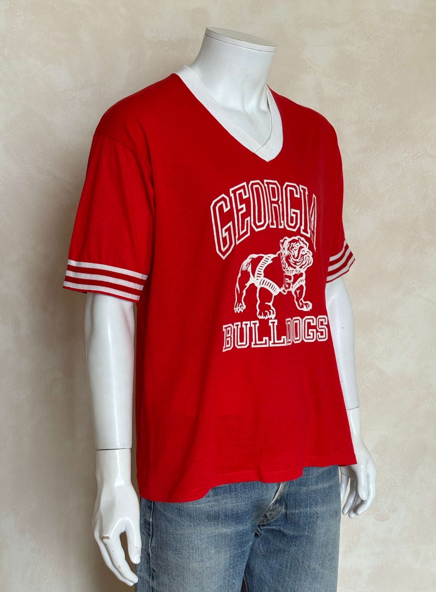 Vintage 1990s Georgia Bulldogs jersey t-shirt with bold collegiate style and classic mascot graphic, size XL