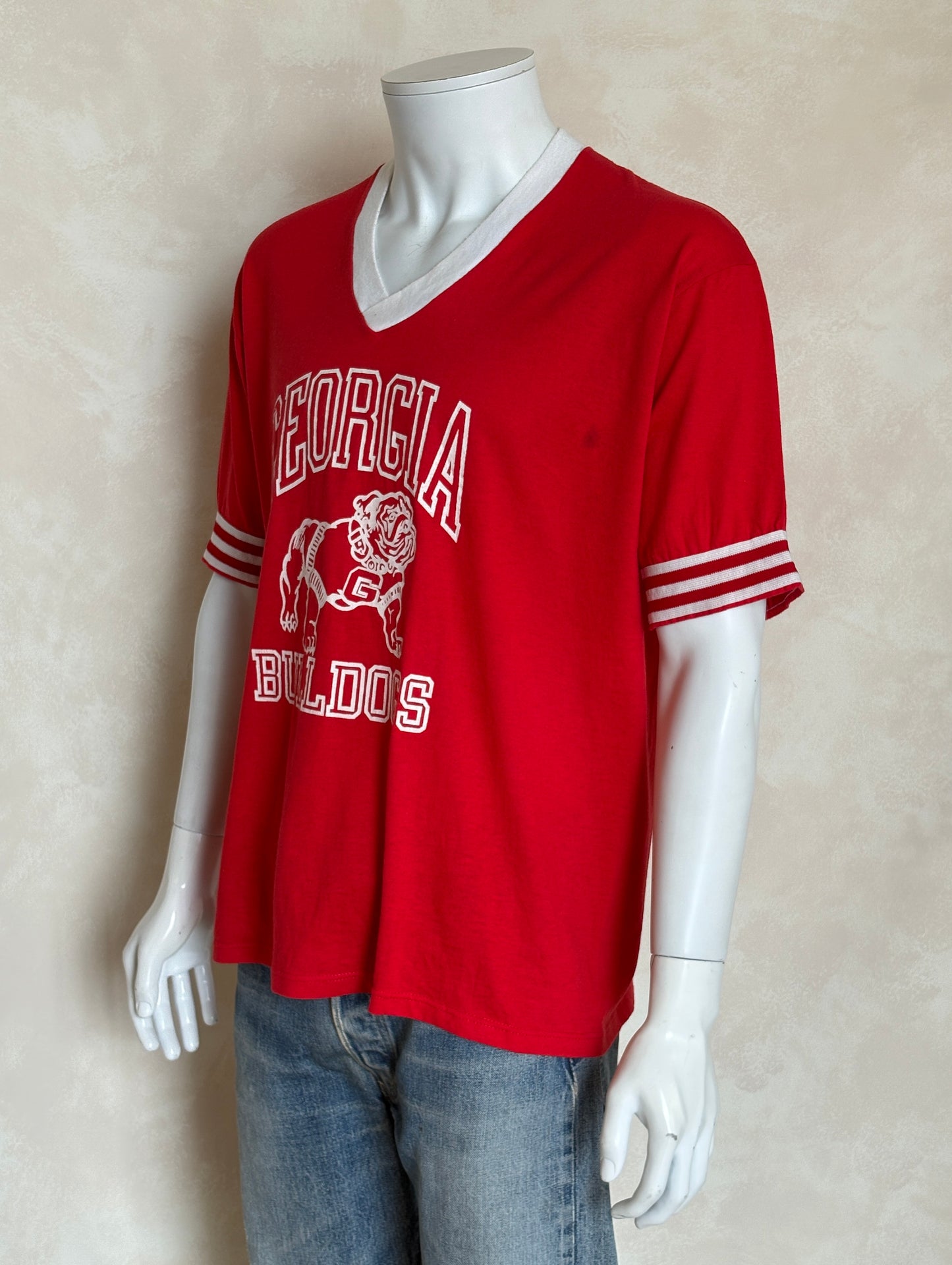 Vintage 1990s Georgia Bulldogs jersey t-shirt with bold collegiate style and classic mascot graphic, size XL