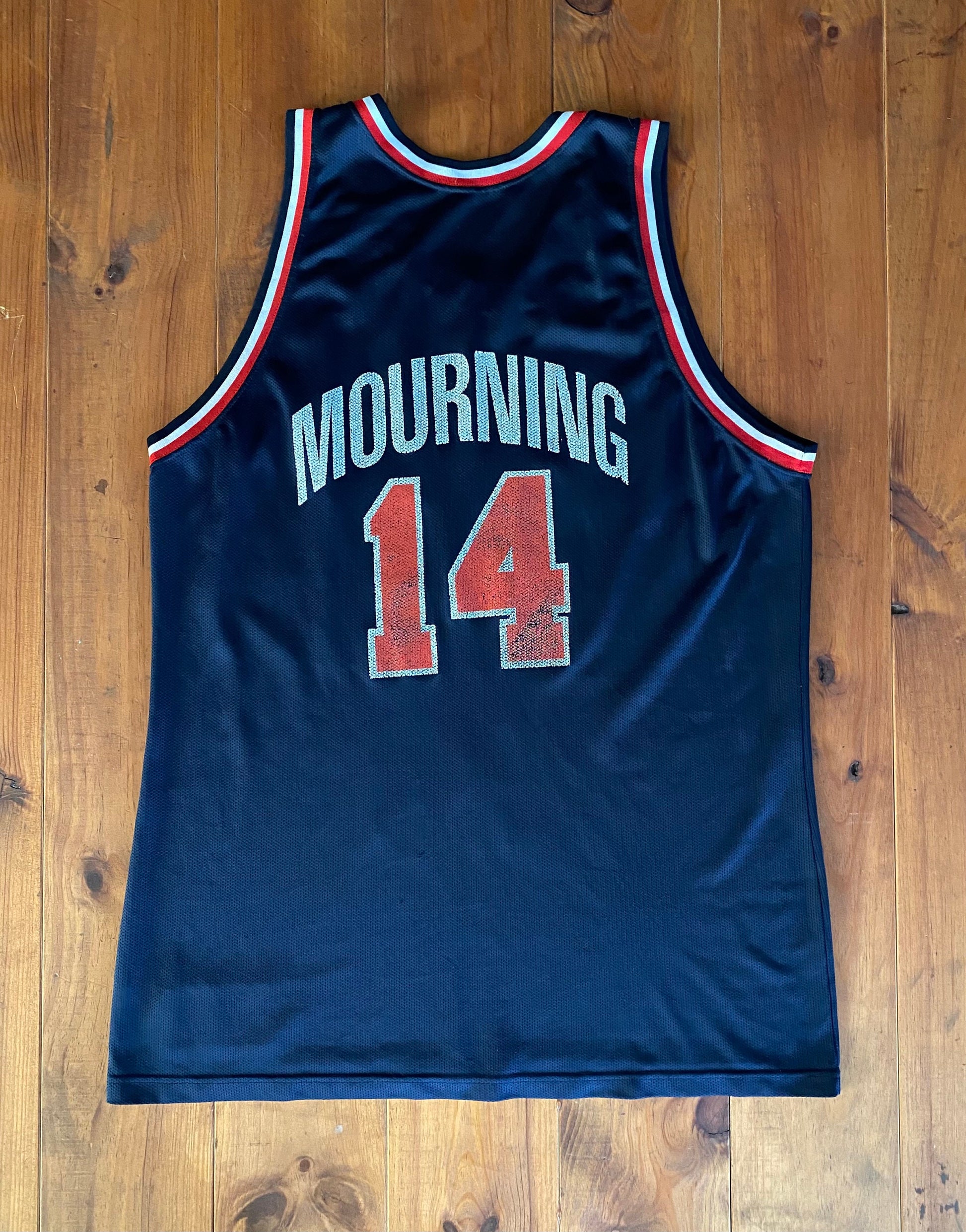Vintage distressed 90s USA Team Champion NBA jersey with player Mourning #14, size 48 - front view.