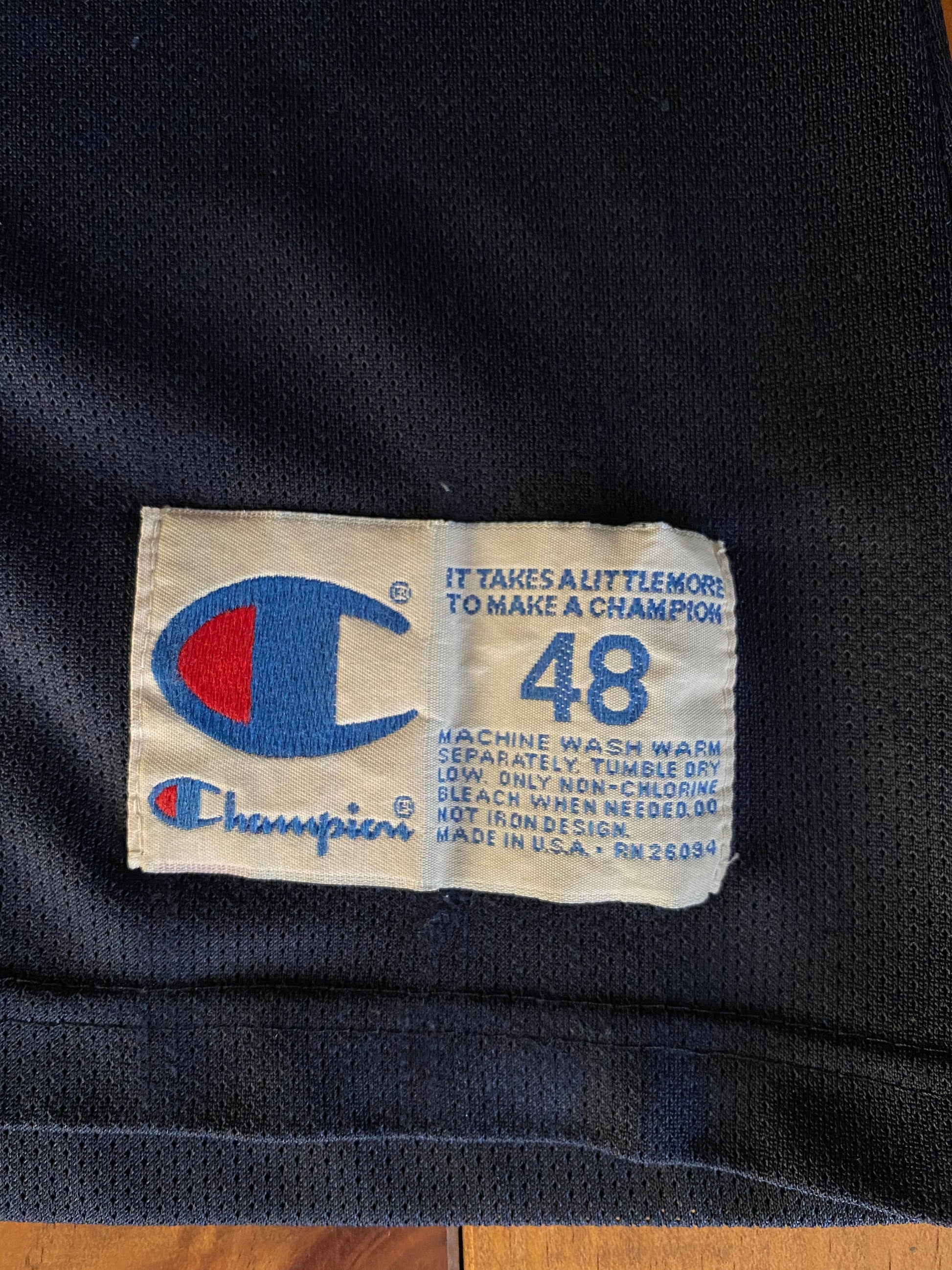 Vintage distressed 90s USA Team Champion NBA jersey with player Mourning #14, size 48 - front view.