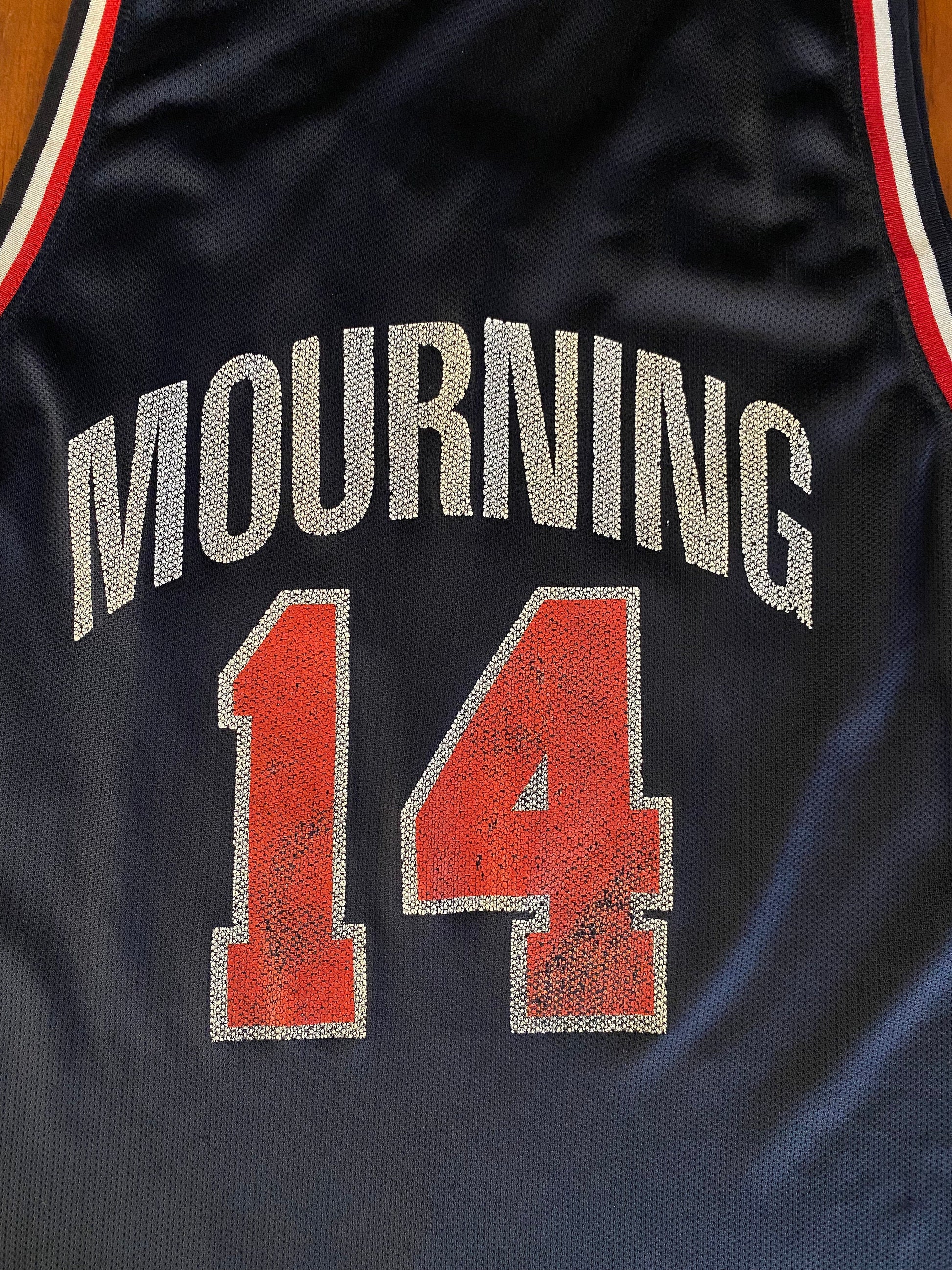 Vintage distressed 90s USA Team Champion NBA jersey with player Mourning #14, size 48 - front view.