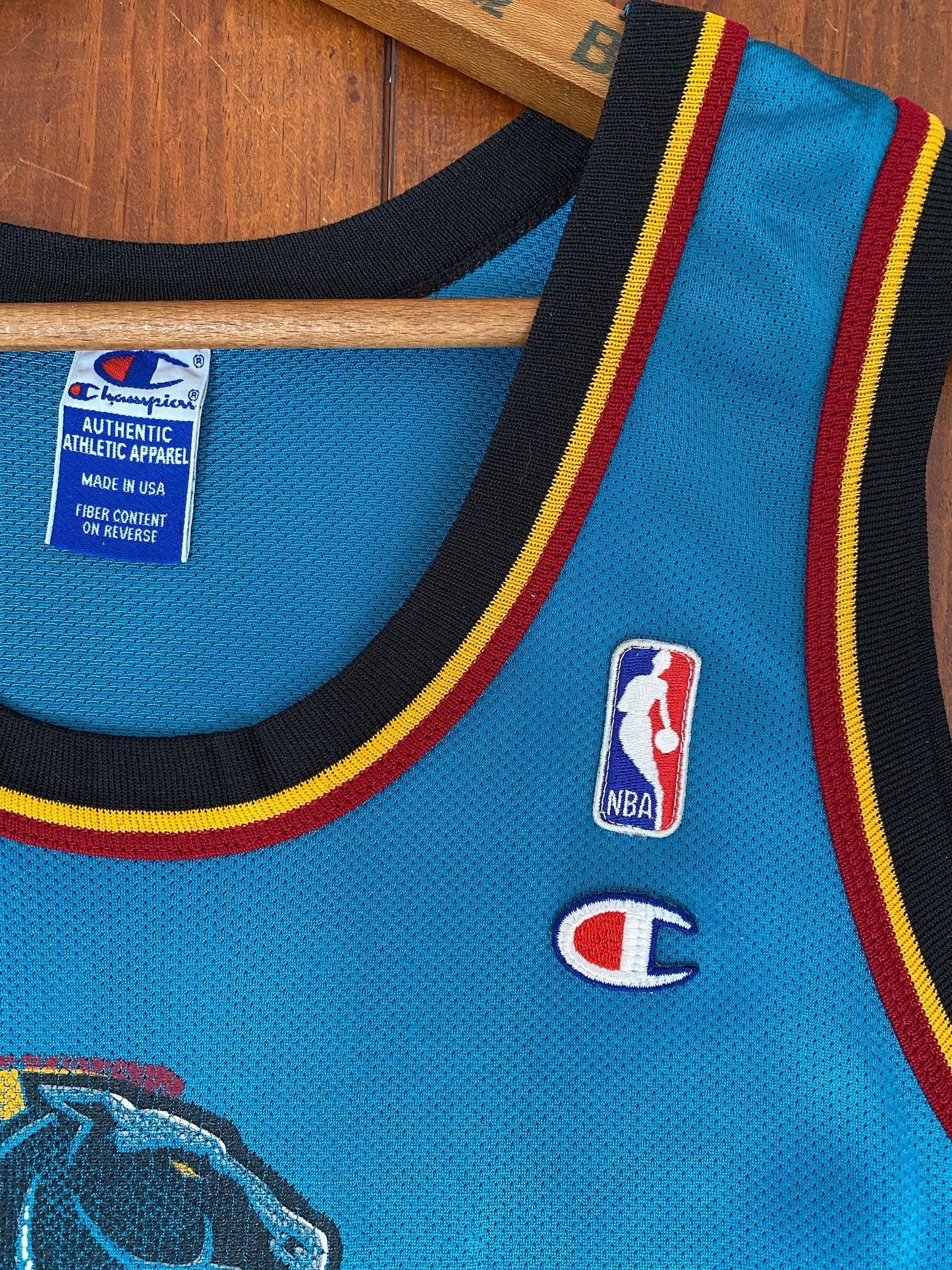 Vintage 90s NBA Champion Detroit Pistons Hill #33 jersey, size 44 - front view. Made in USA by Champion.