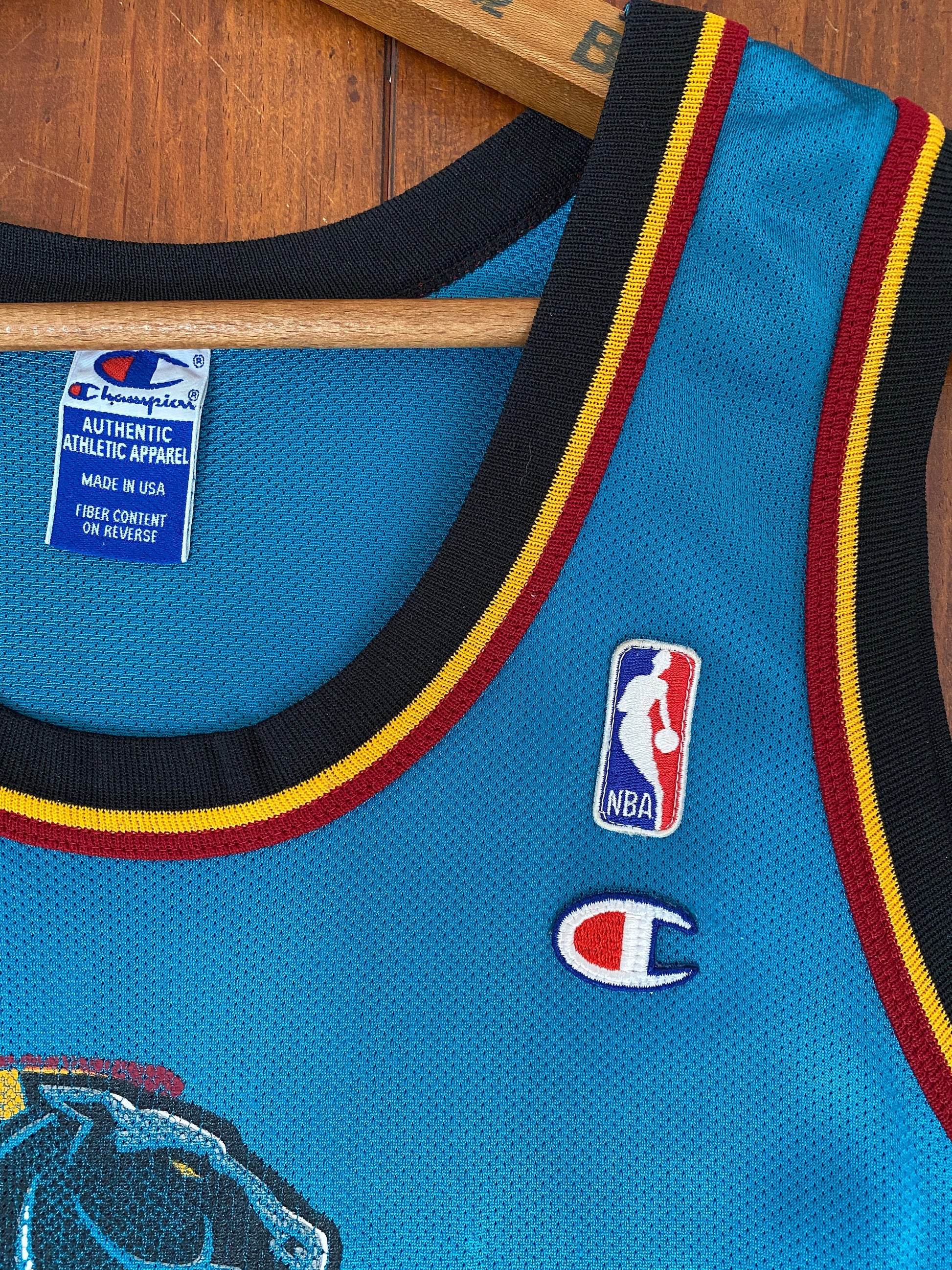Vintage 90s NBA Champion Detroit Pistons Hill #33 jersey, size 44 - front view. Made in USA by Champion.