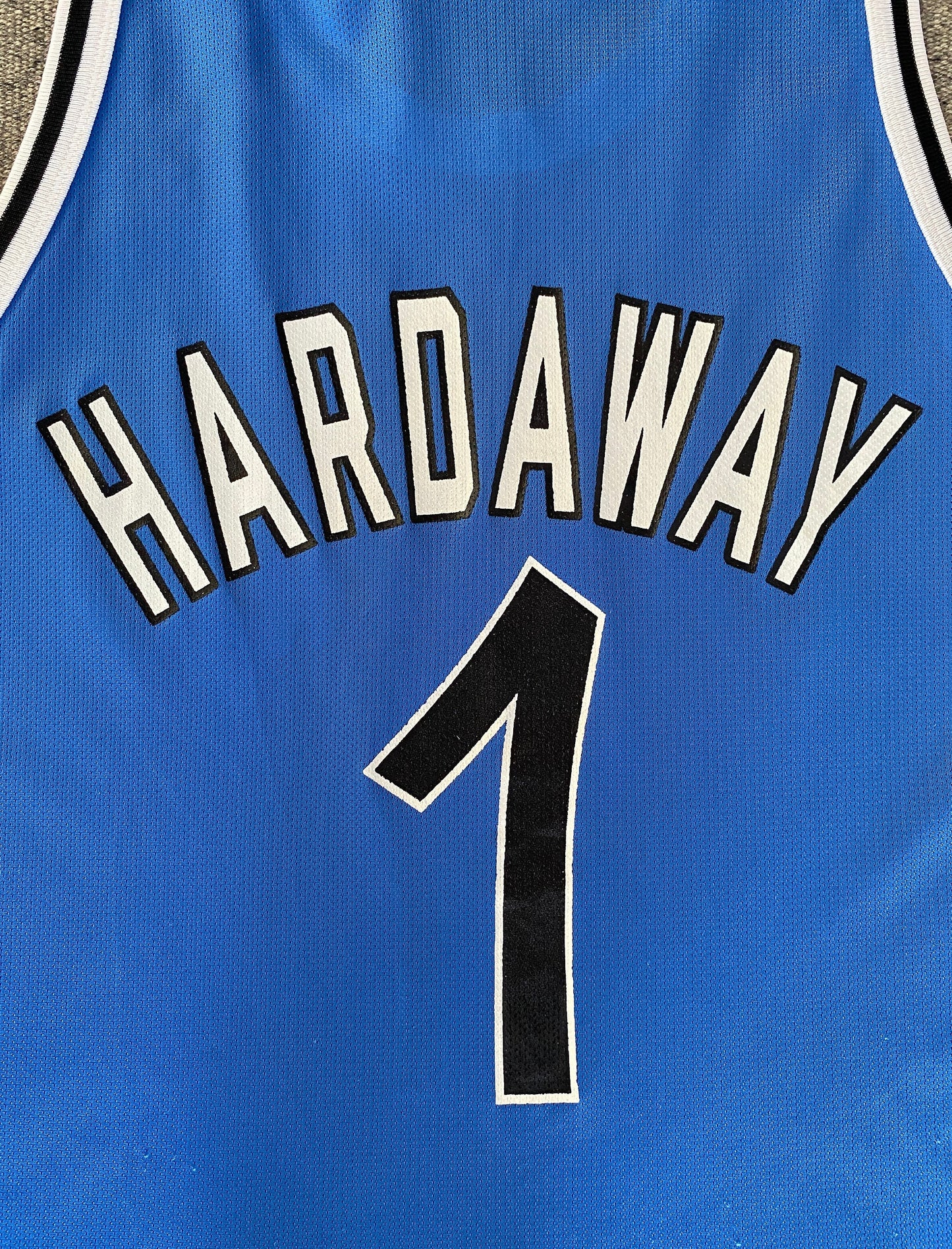 Vintage 90s Champion NBA jersey with player Hardaway #1, size 44 - back view, Orlando Magic. Made in USA.