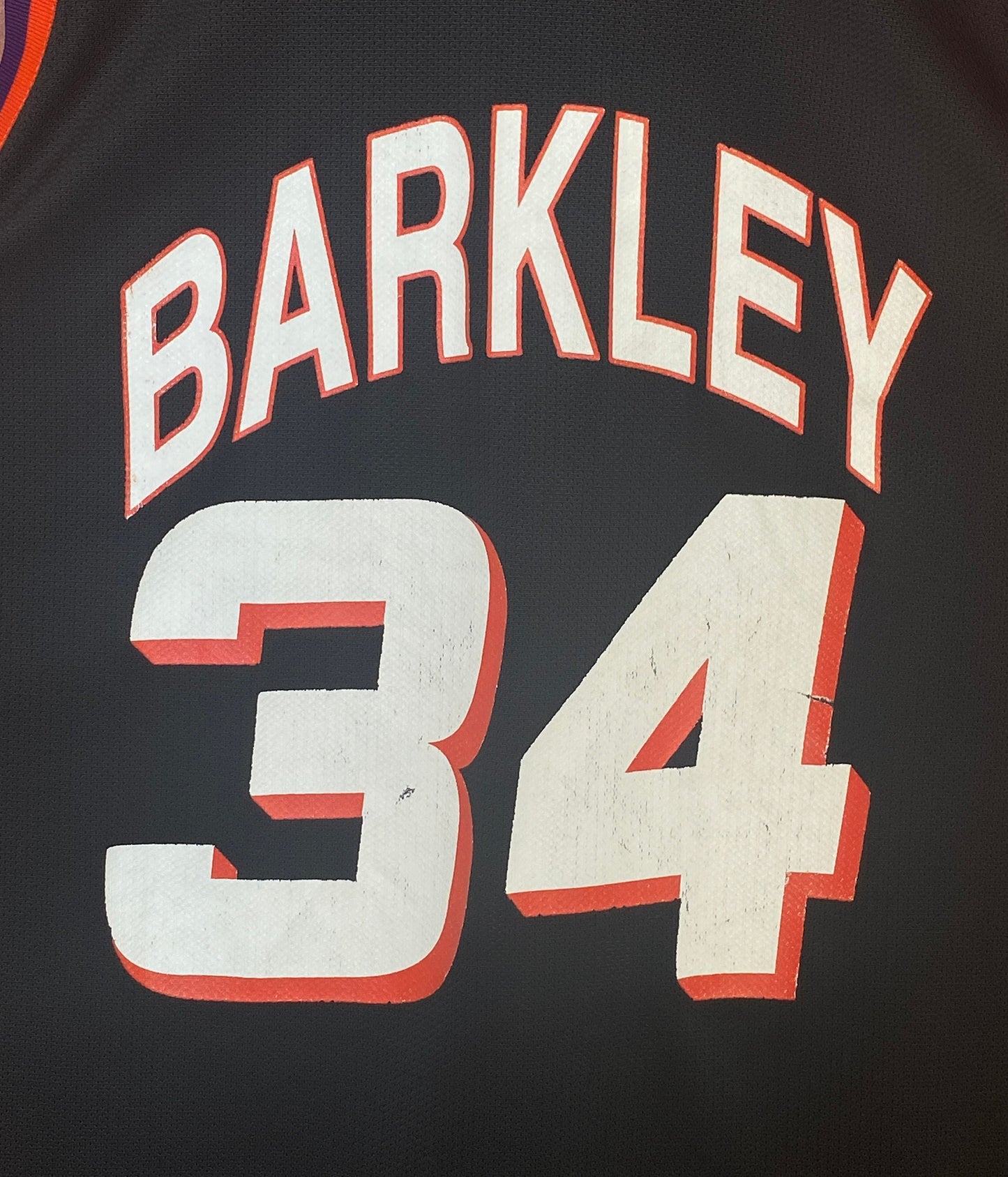Vintage 90s NBA Phoenix Suns Charles Barkley #34 jersey, size 44 - back view. Made in USA by Champion.