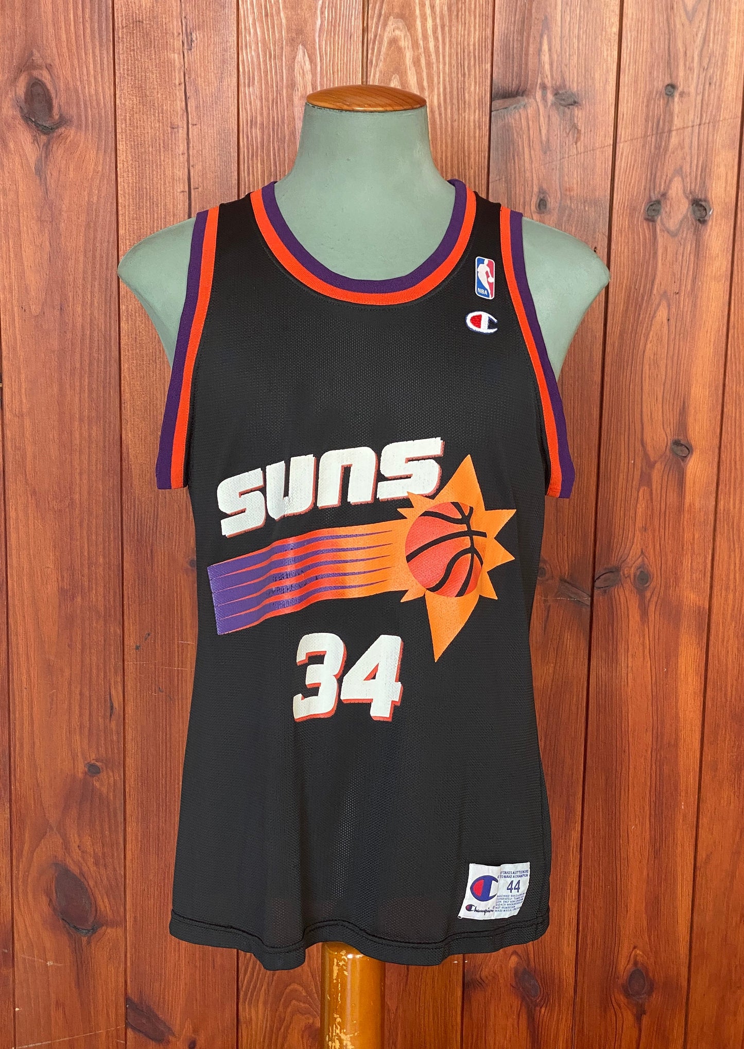 Vintage 90s NBA Phoenix Suns Charles Barkley #34 jersey, size 44 - front view. Made in USA by Champion.