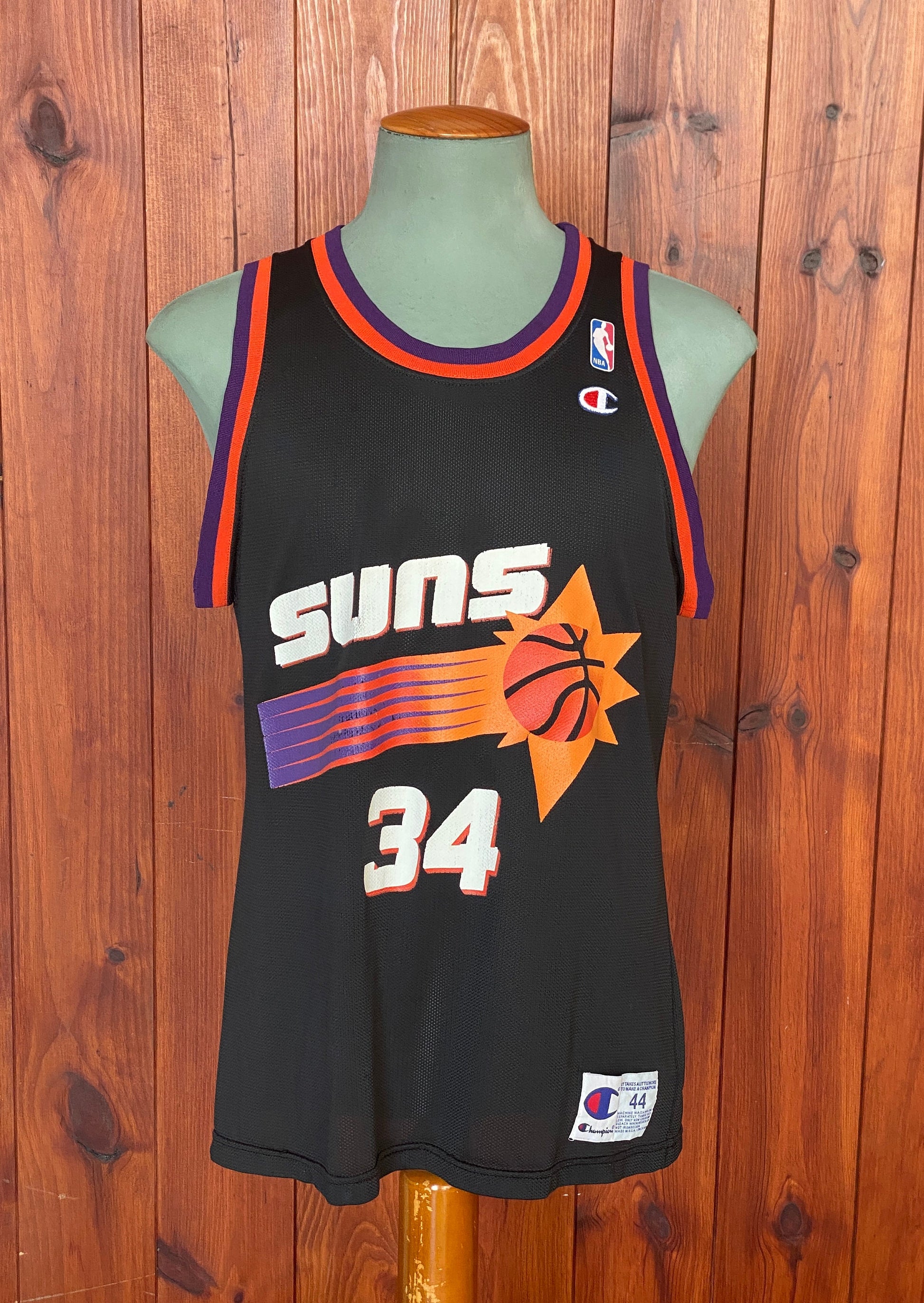 Vintage 90s NBA Phoenix Suns Charles Barkley #34 jersey, size 44 - front view. Made in USA by Champion.