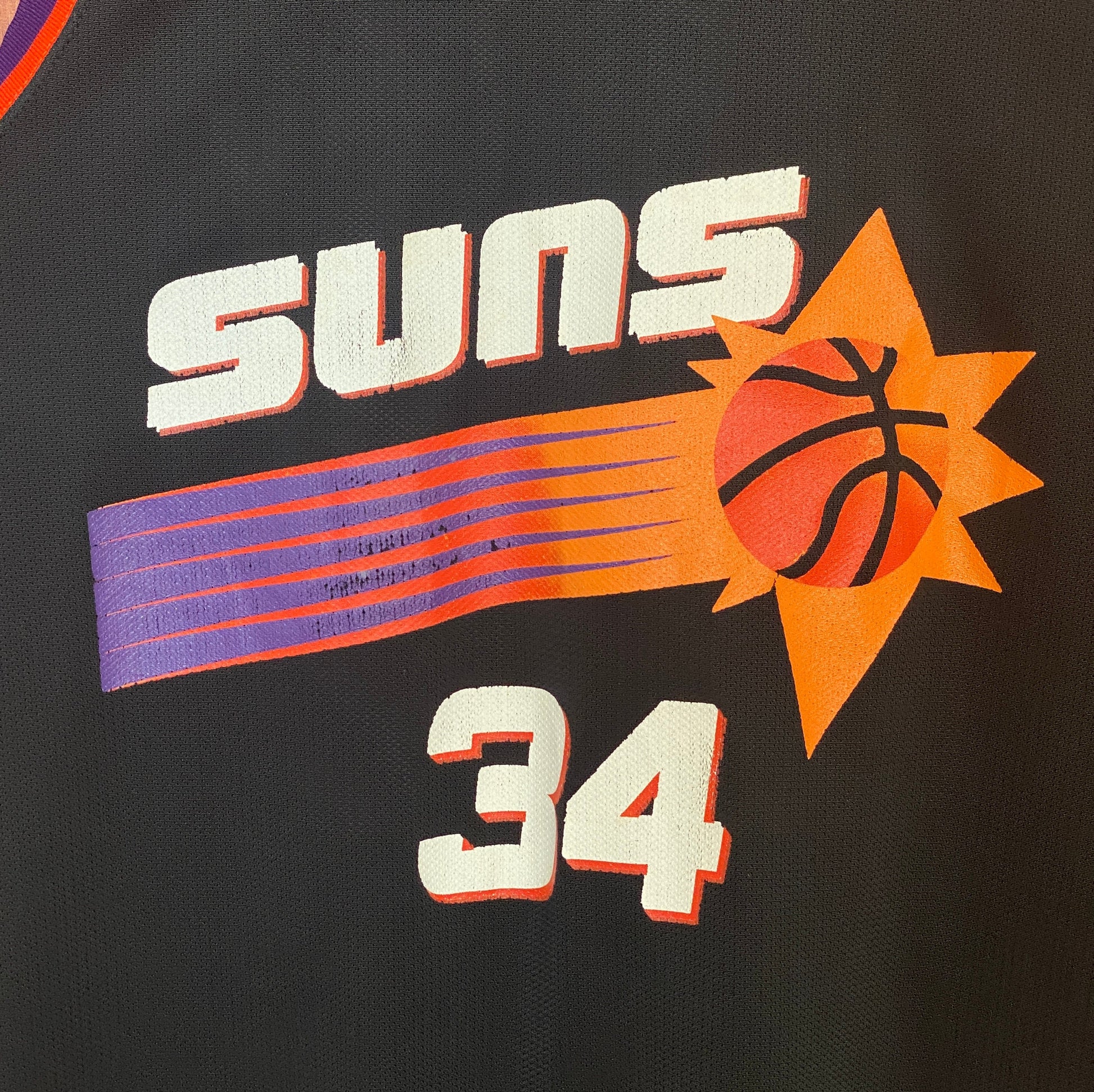 Vintage 90s NBA Phoenix Suns Charles Barkley #34 jersey, size 44 - front view. Made in USA by Champion.