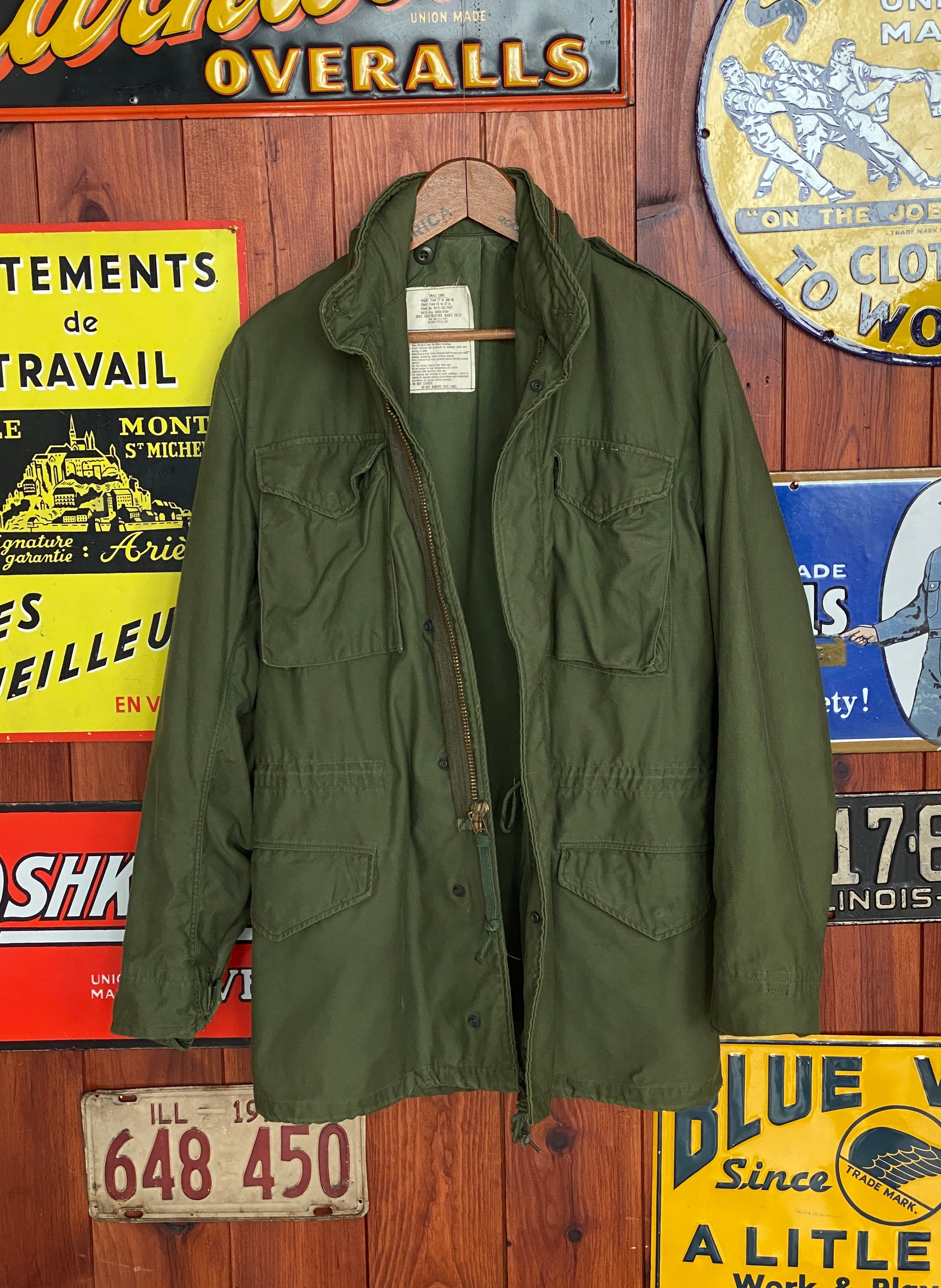Vintage 1972 Vietnam War era US Army M-65 OG-107 field jacket, size Small.