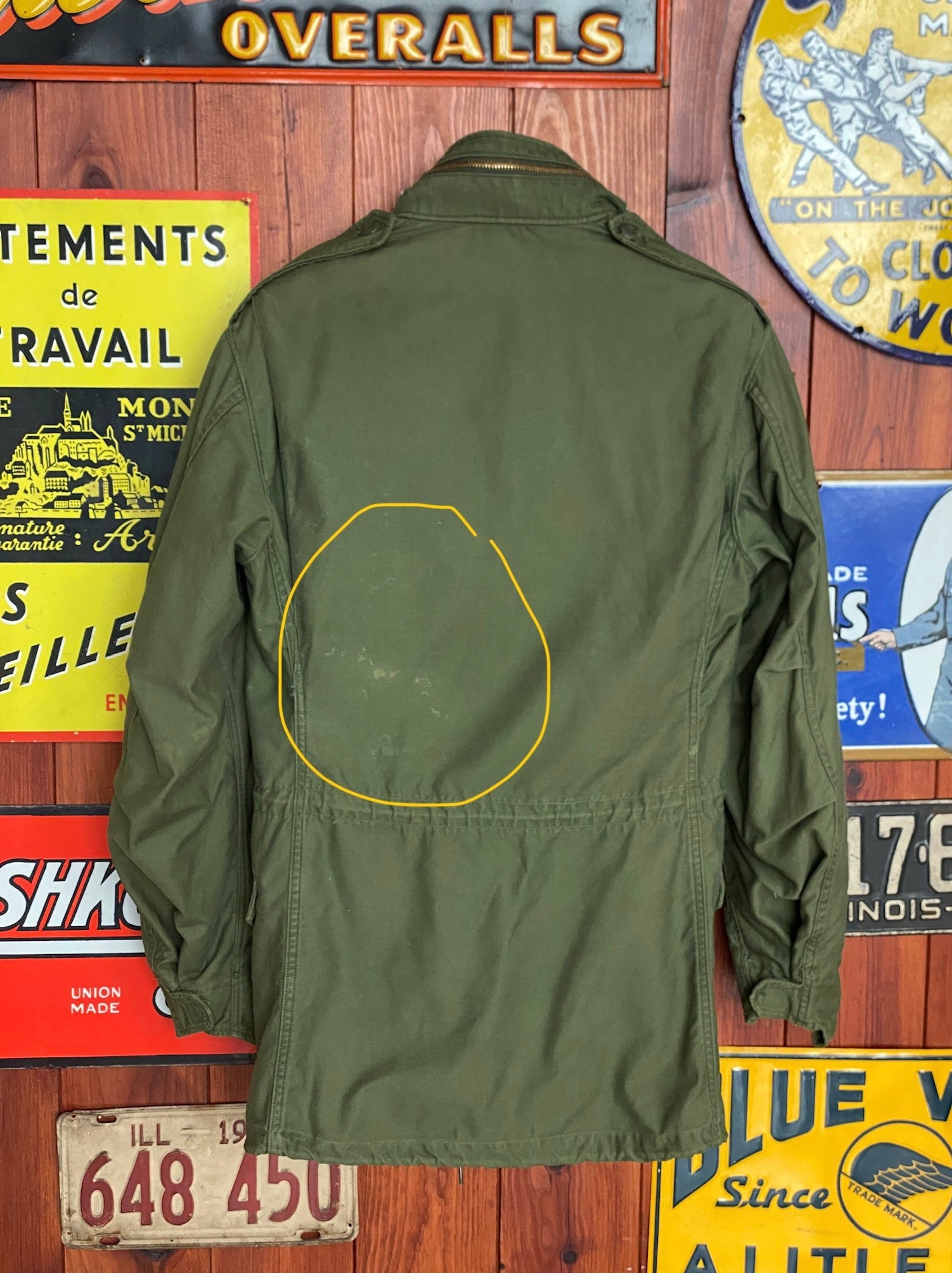 Vintage 1972 Vietnam War era US Army M-65 OG-107 field jacket, size Small.