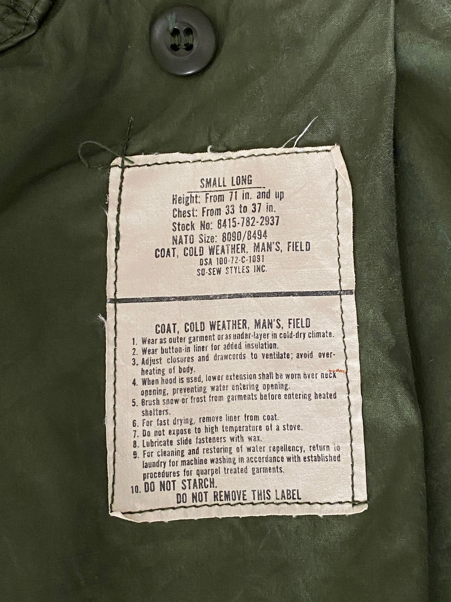 Vintage 1972 Vietnam War era US Army M-65 OG-107 field jacket, size Small.