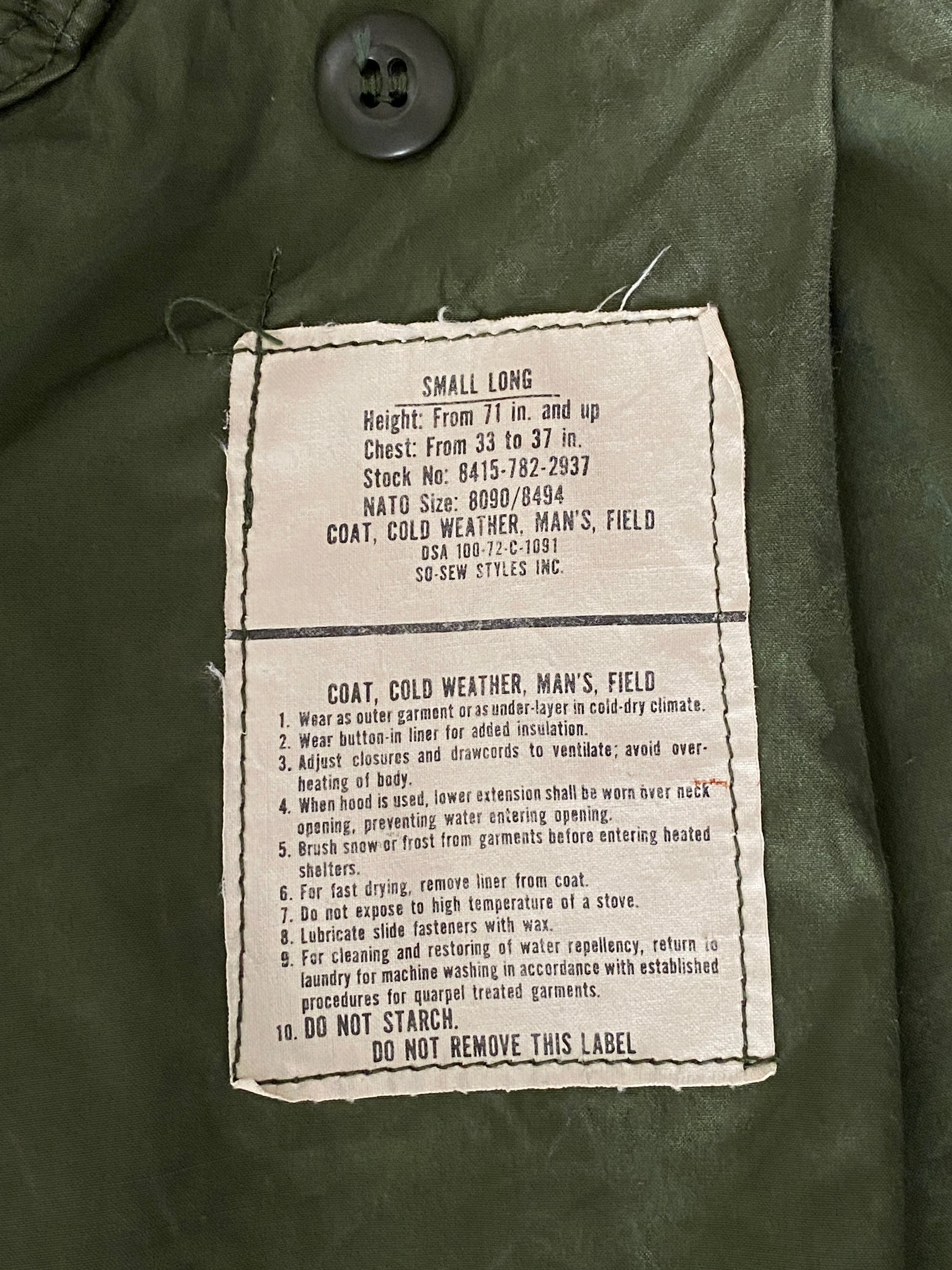 Vintage 1972 Vietnam War era US Army M-65 OG-107 field jacket, size Small.