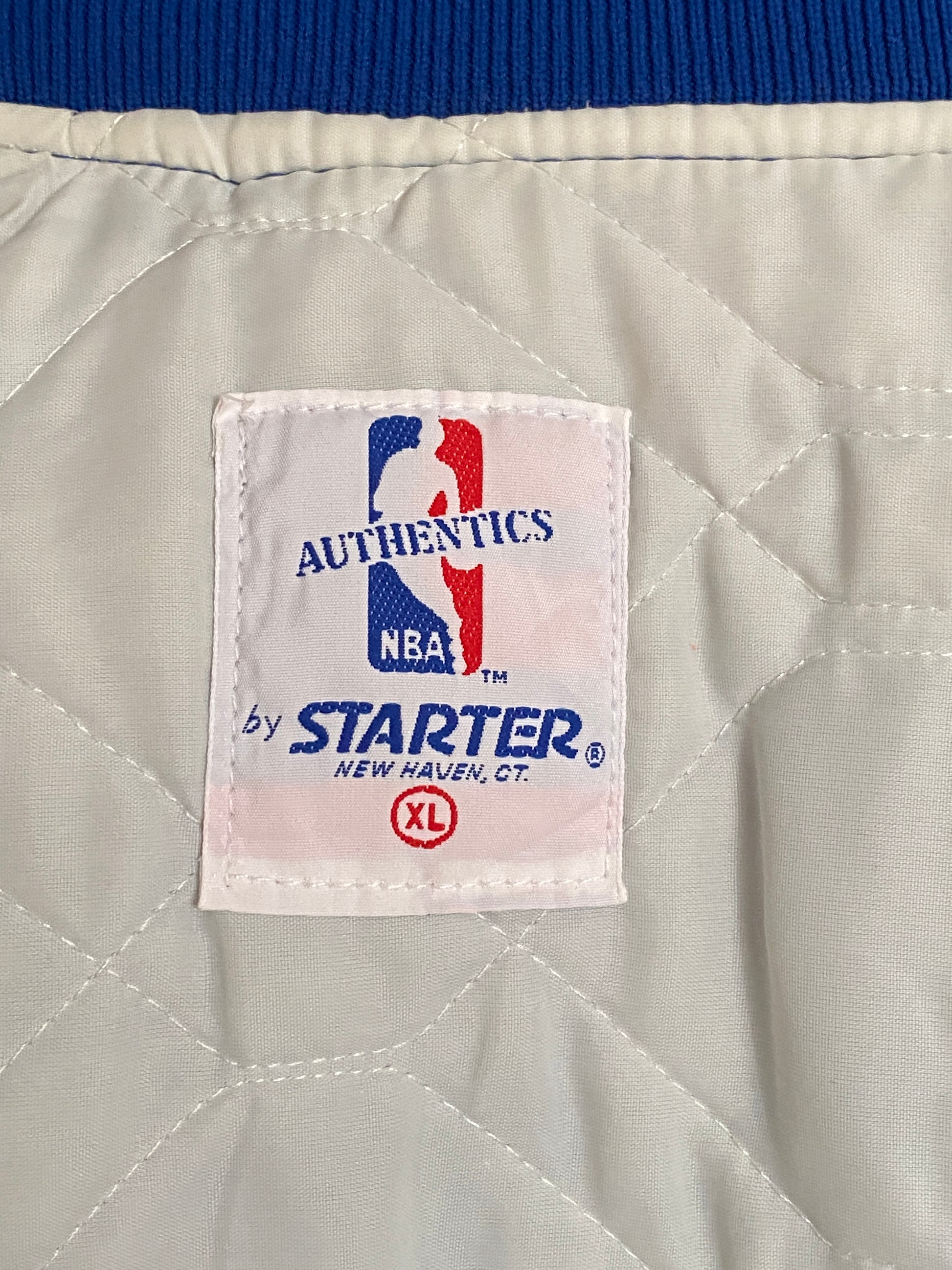 Vintage 1980s Cleveland Cavaliers Starter satin jacket with retro logo and bold team colors, size XL