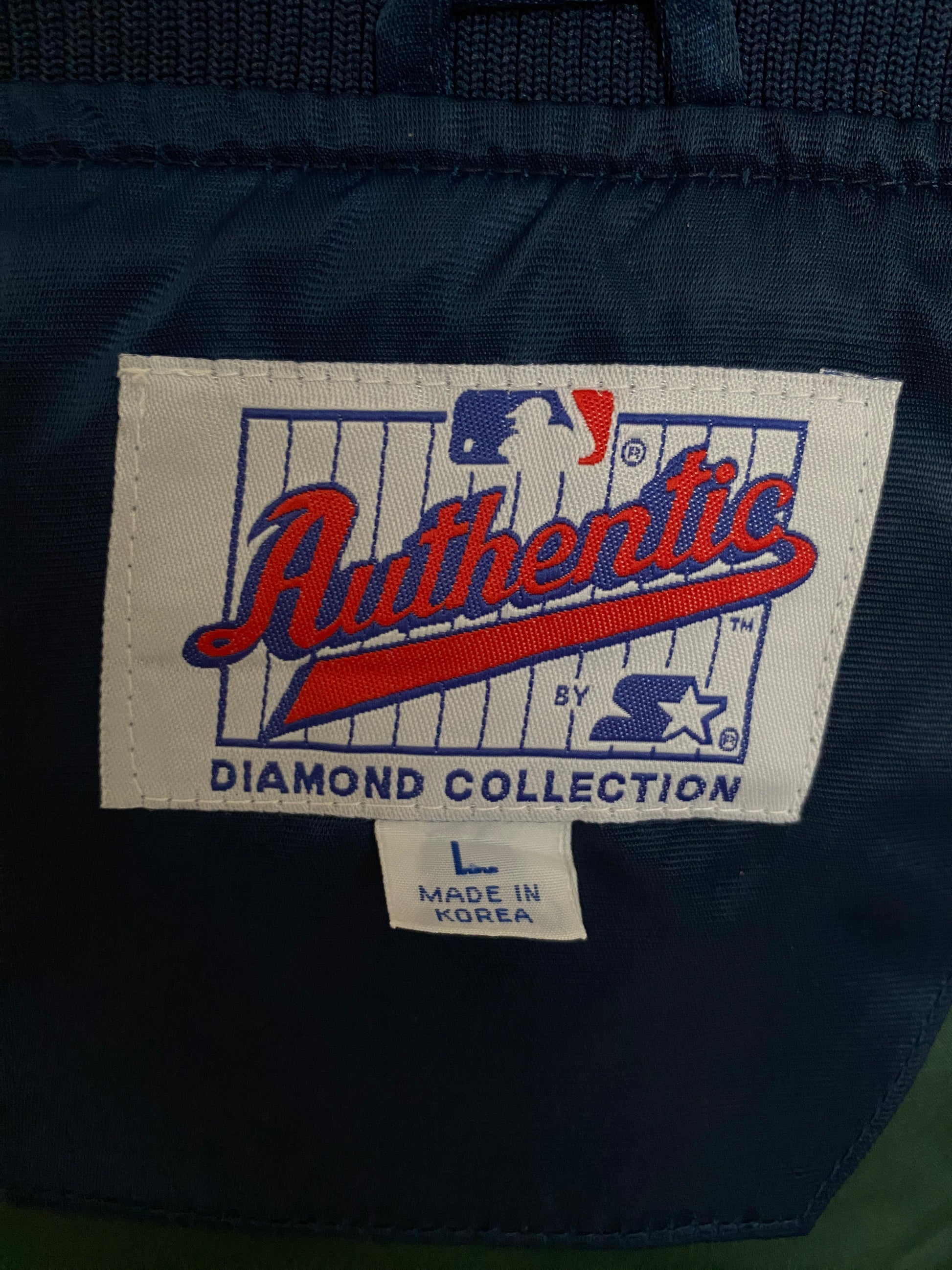 Vintage 1980s Milwaukee Brewers Starter satin jacket with team logo, size large
