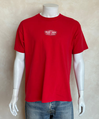 Vintage Ron Jon Surf Shop tee – bold comic-style surfer graphic with pure 90s beach energy. Large-AJ357 Studio