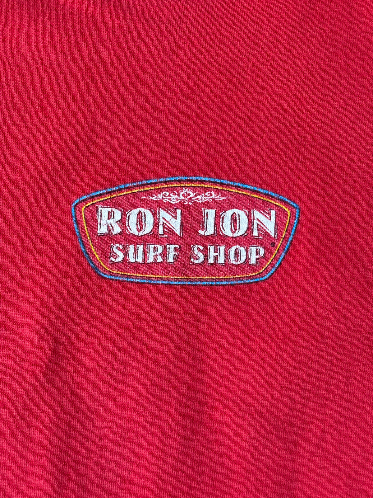 Vintage Ron Jon Surf Shop tee – bold comic-style surfer graphic with pure 90s beach energy. Large-AJ357 Studio