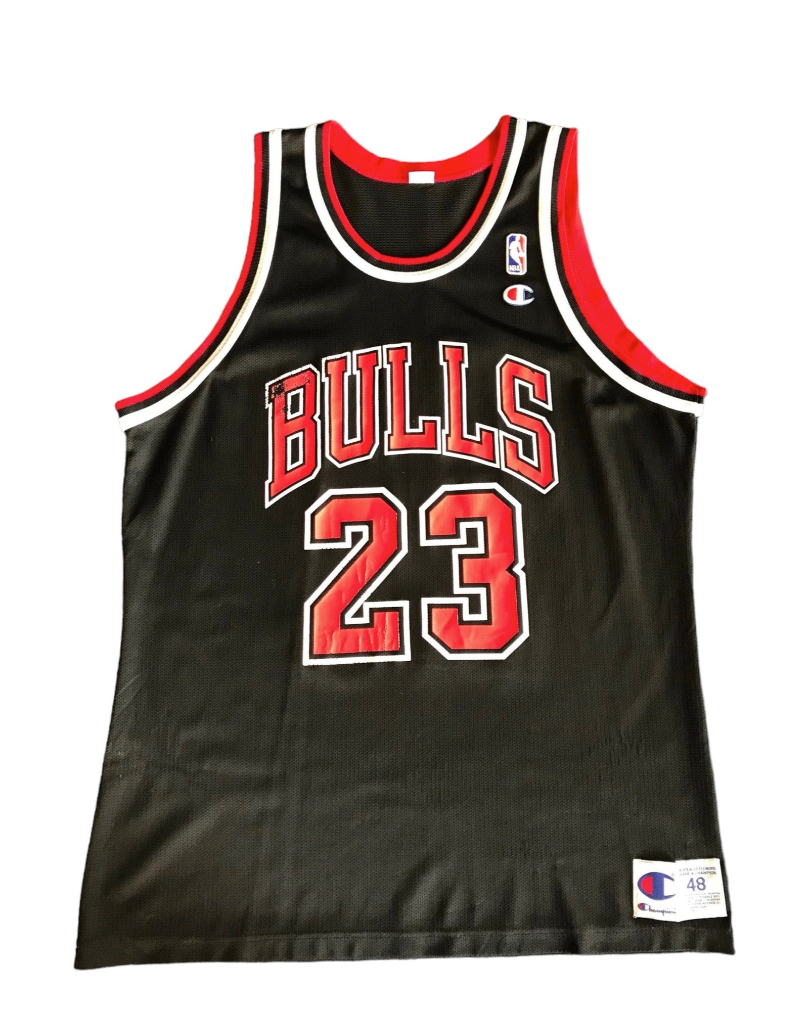 Vintage Champion Michael Jordan Jersey for the Chicago Bulls in black with red and white text, number 23, and the Bulls logo.